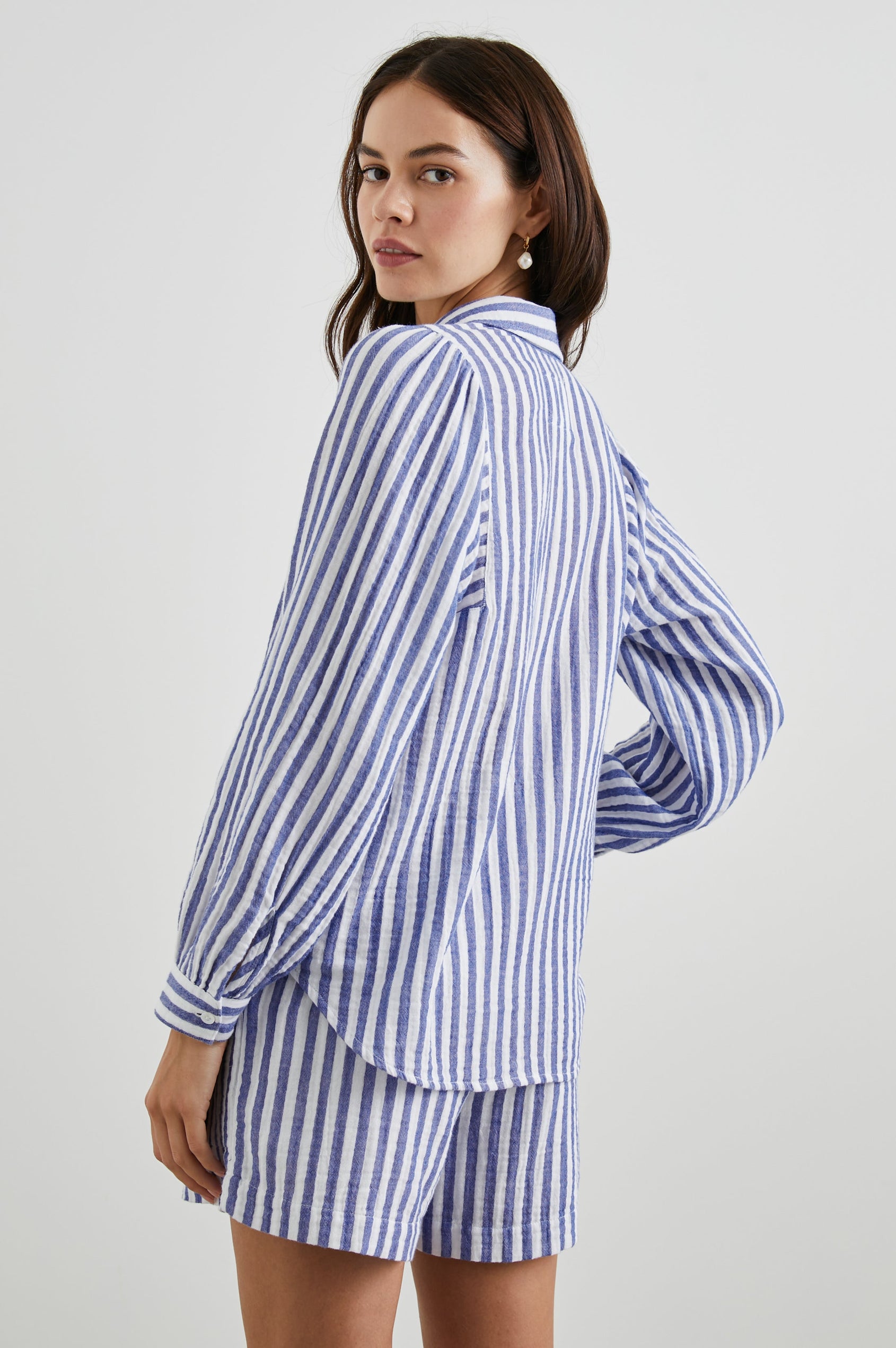 Lo Long-Sleeve Button Up with a V Neck in Anacapa Stripe Colorway, Blue and White Vertical Stripes - Back View Featured on Model