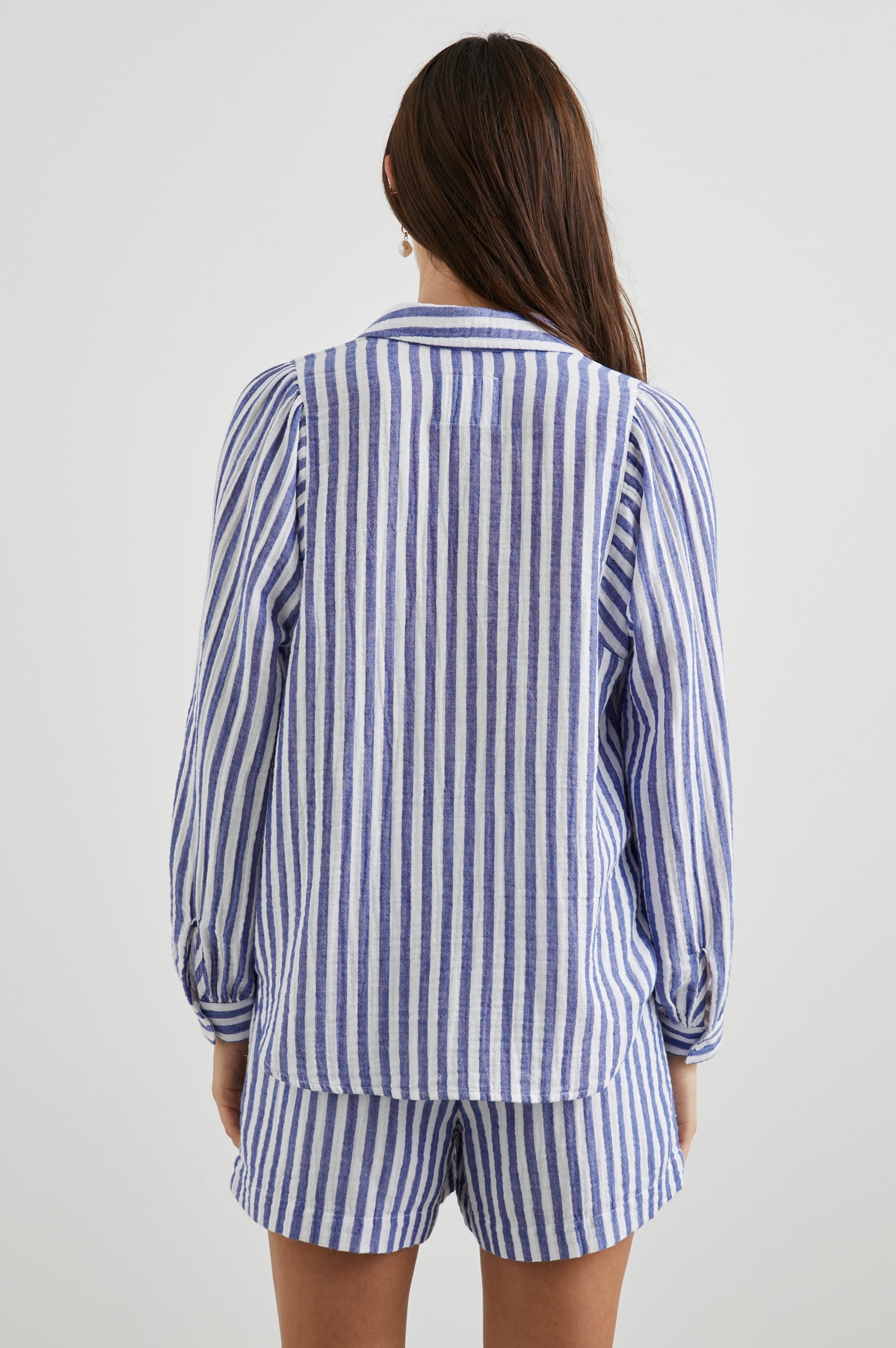 Lo Long-Sleeve Button Up with a V Neck in Anacapa Stripe Colorway, Blue and White Vertical Stripes - Back View Featured on Model