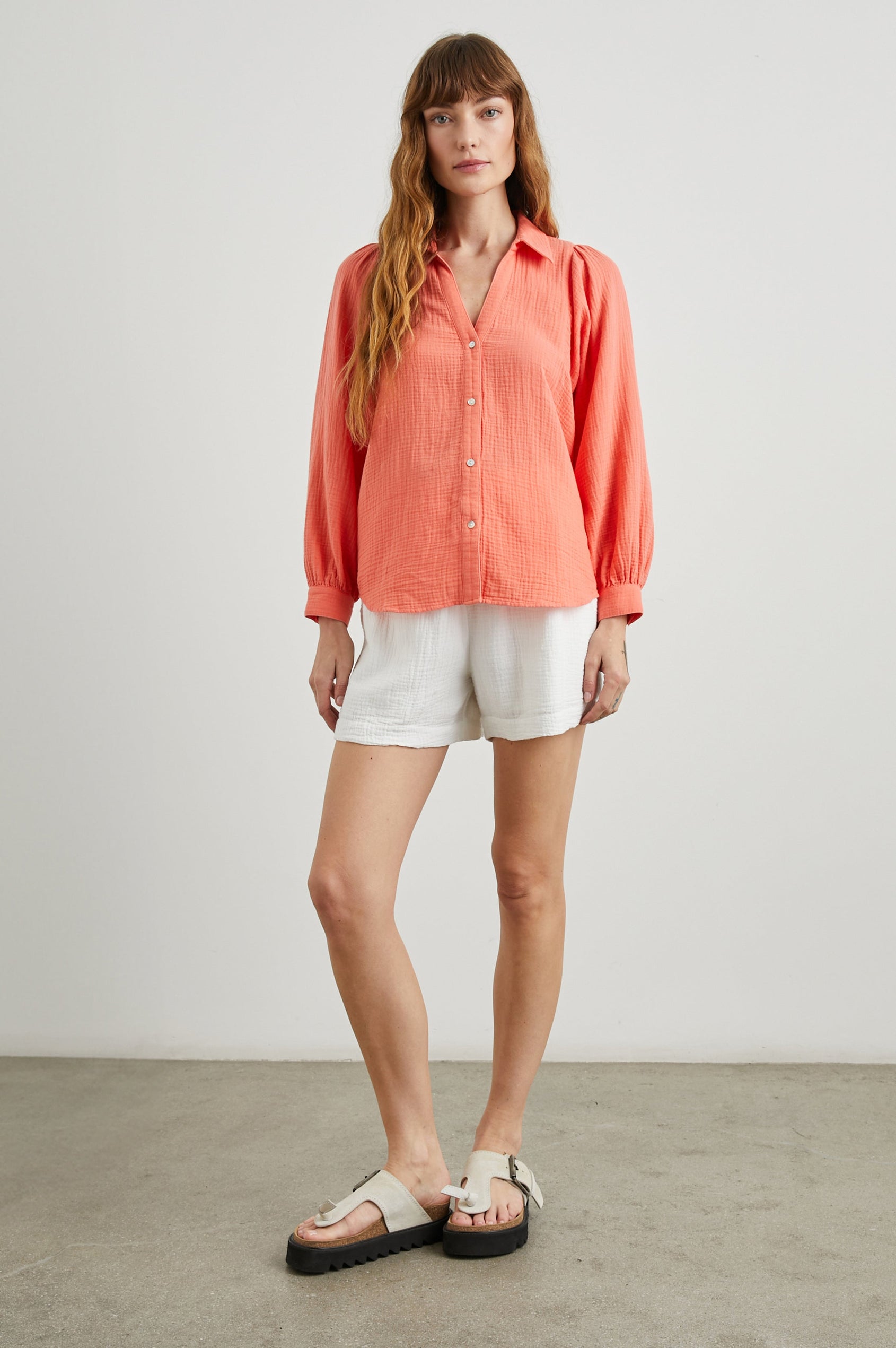 Lo Long-Sleeve Button Up with a V Neck in Papaya Colorway - Front Full Body View Featured on Model