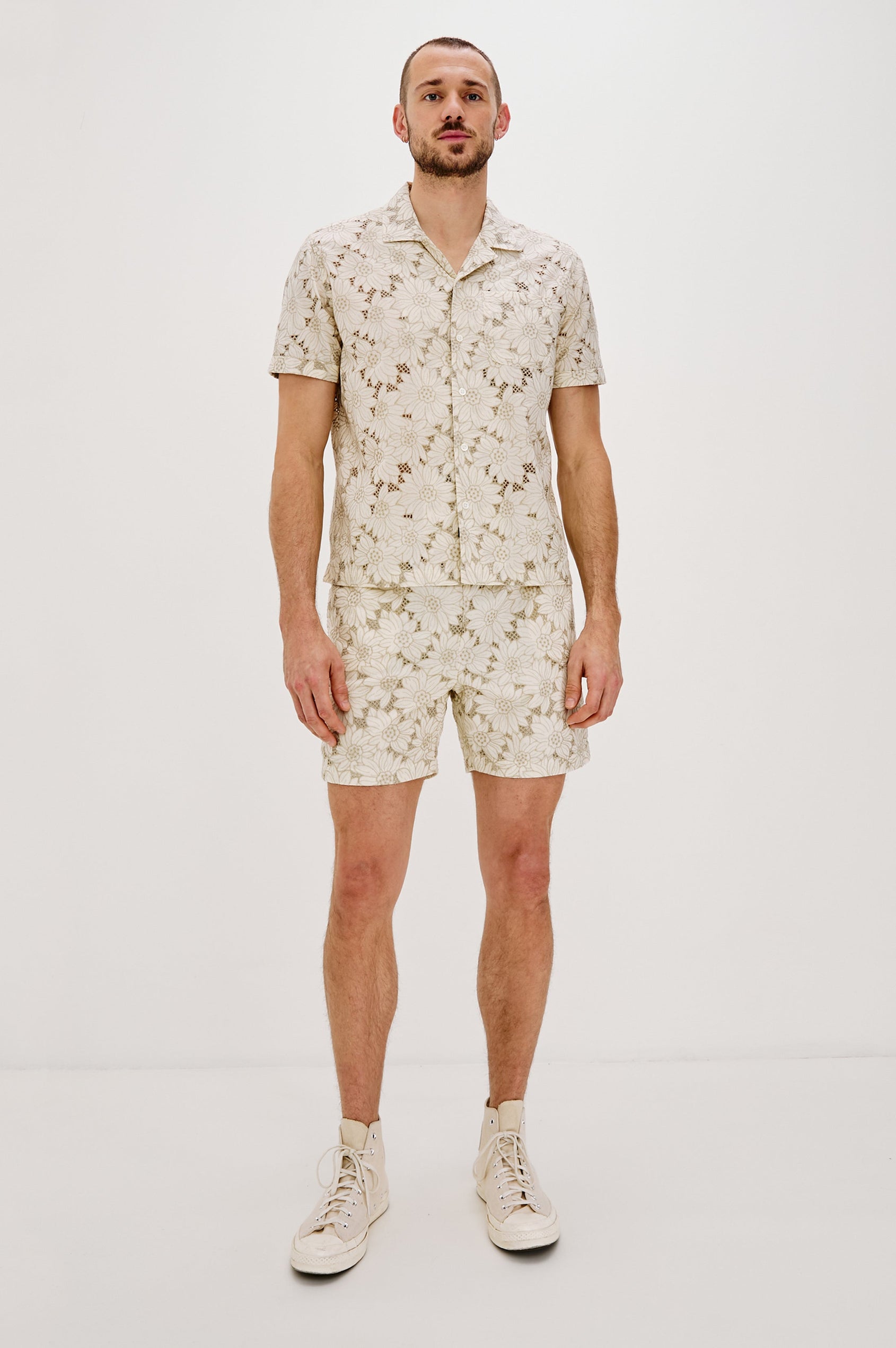 Logan Swim Short with a Drawstring Waistband and Side Pockets in Multi Blue Sunflower Colorway. Front View Shown on Model.