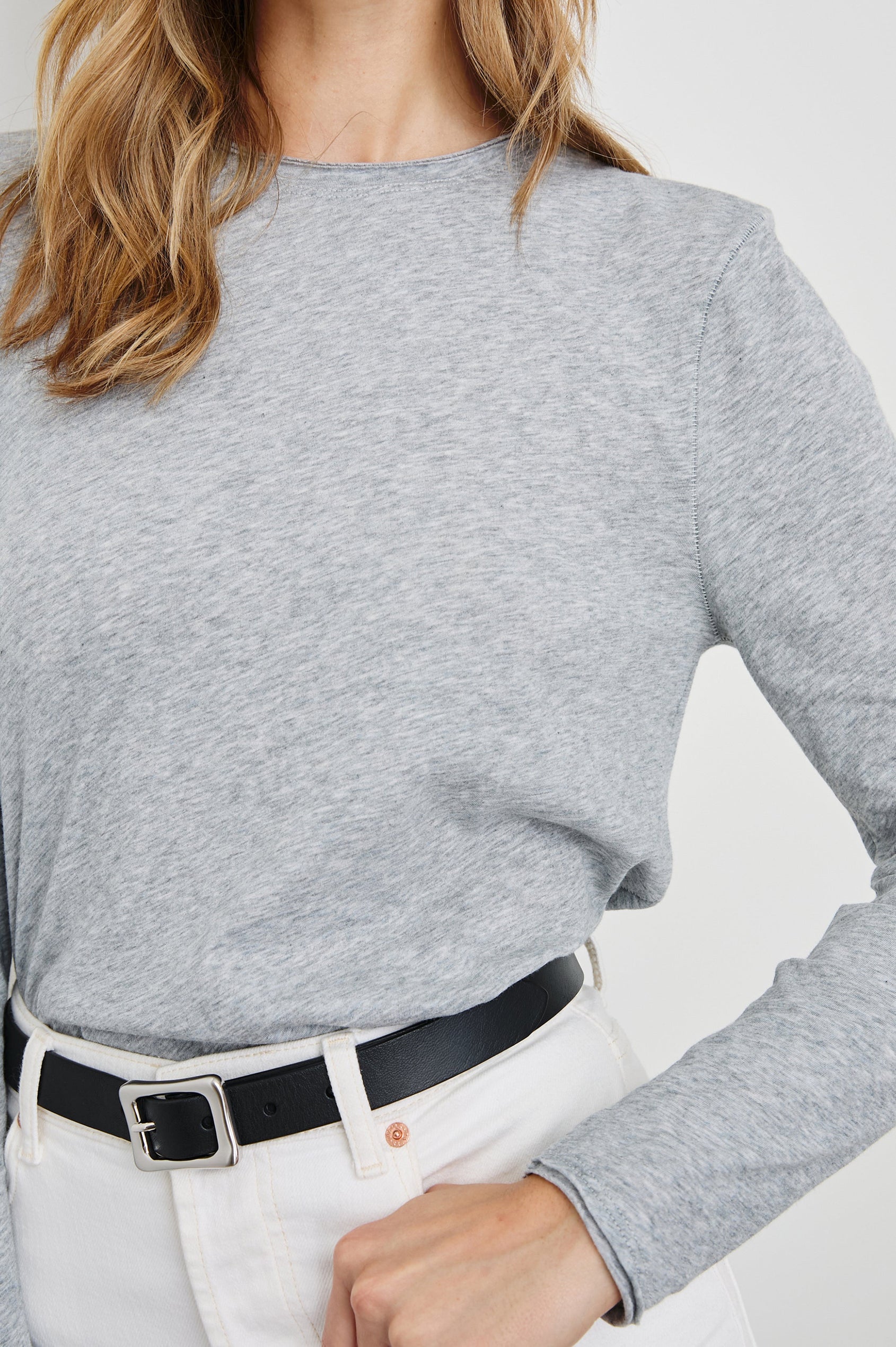 Long Sleeve Crew Neck T Shirt with Raw Hem, Collar and Cuffs in Heather Grey Colorway - Front View Featured on Model