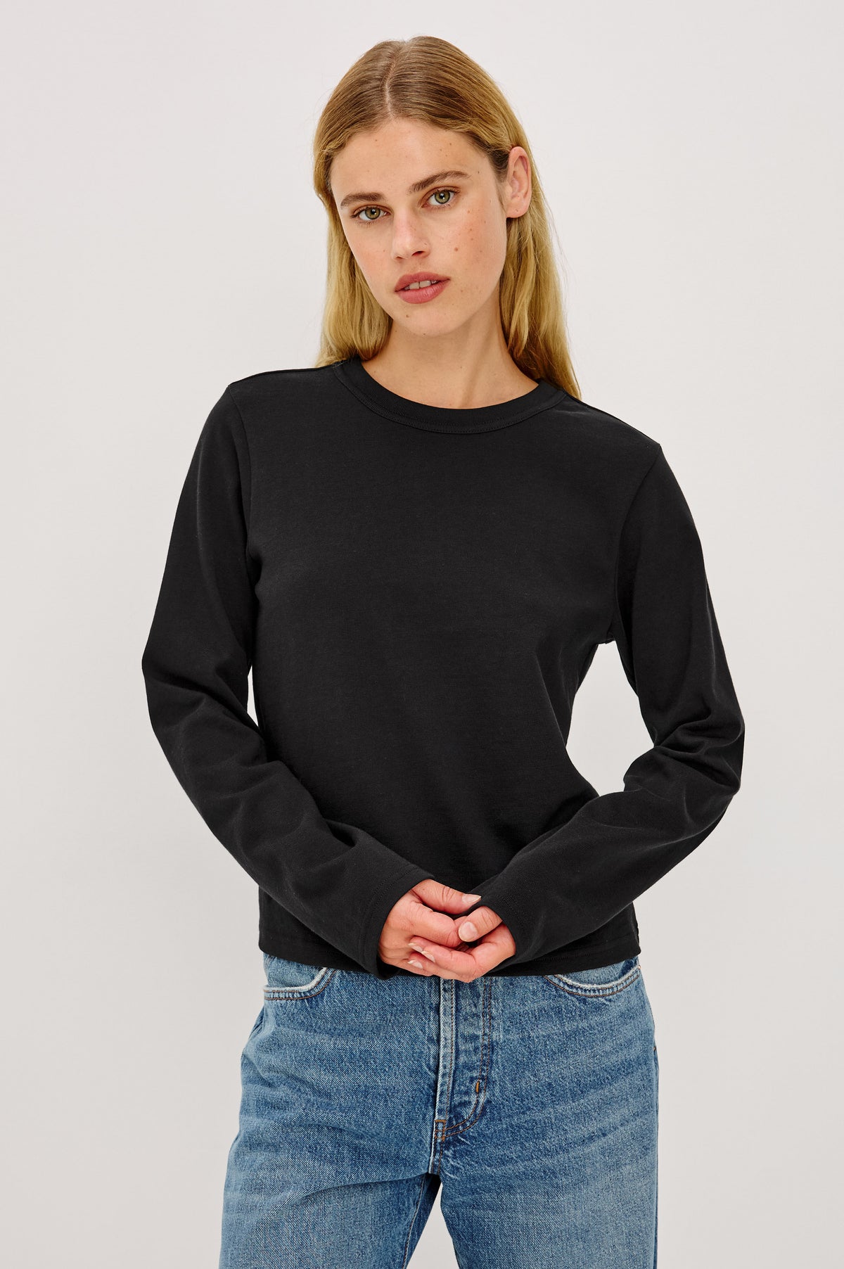 Long Sleeve Girlfriend Tee in Midweight Pleated Jersey in Slightly Boxy Cropped Fit With Crew Neckline in Black Colorway - Front Crop View Featured on Model.