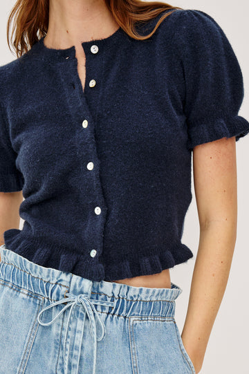 Lora Top in Wool Blend With Front Buttons, Short Puff Sleeves, Ruffle Trim, and Classic Fit in Navy Colorway - Upper Body Close Up View Featured on Model