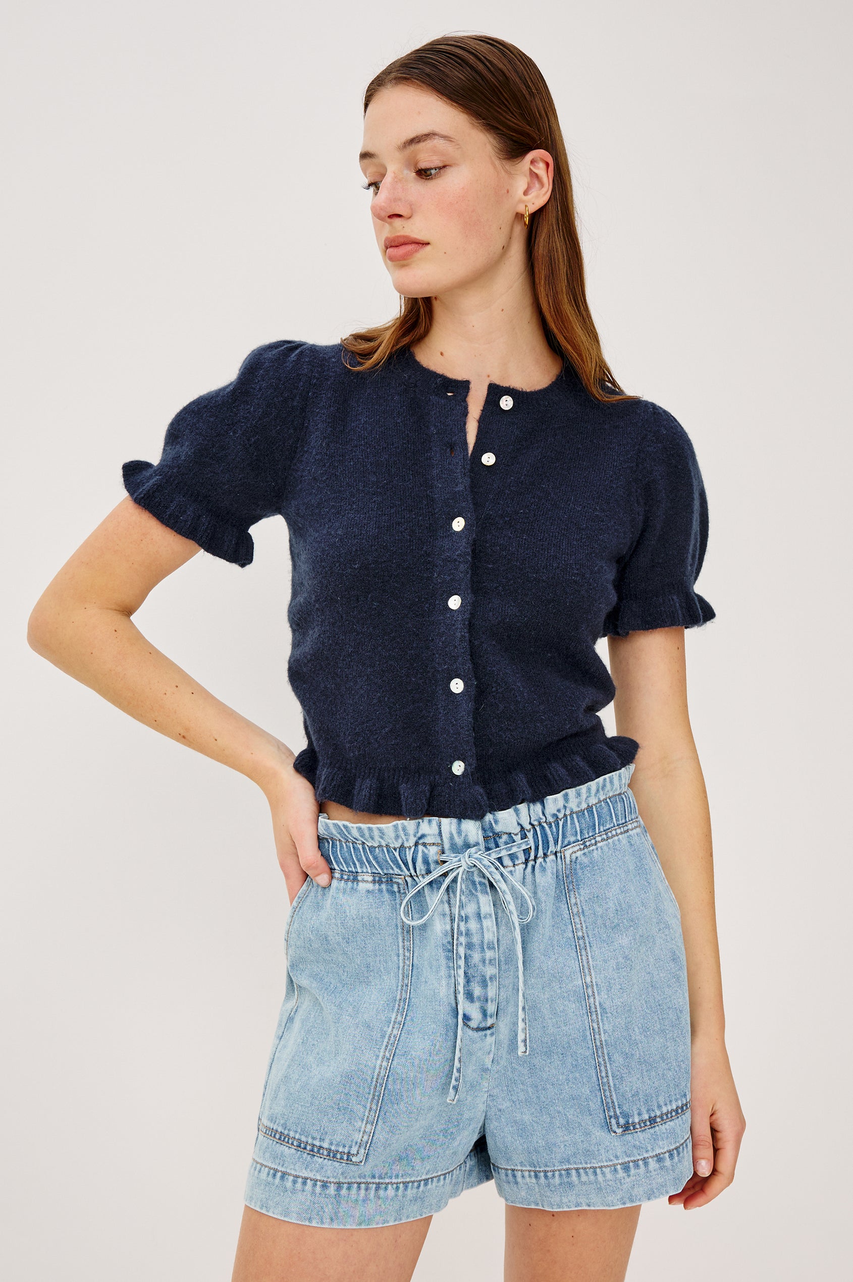 Lora Top in Wool Blend With Front Buttons, Short Puff Sleeves, Ruffle Trim, and Classic Fit in Navy Colorway - Upper Body Front View Featured on Model