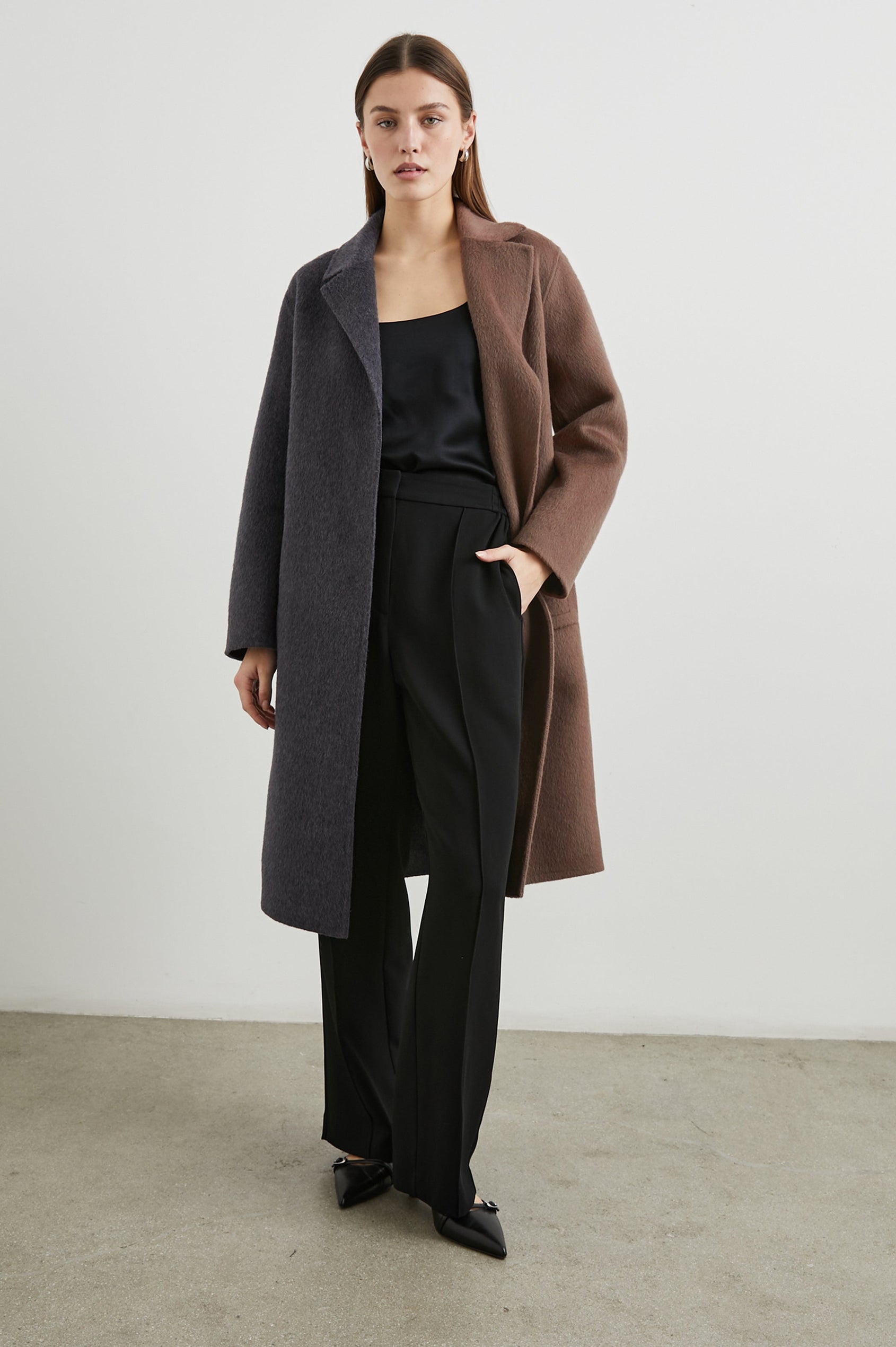 Lore Knee-Length Coat with Two Button Closure, Notched Lapels and Two Front Pockets in Charcoal Mink Mix Colorway, Left Half of Jacket is Mink and the Right Half is Charcoal - Front Full Body View Featured on Model