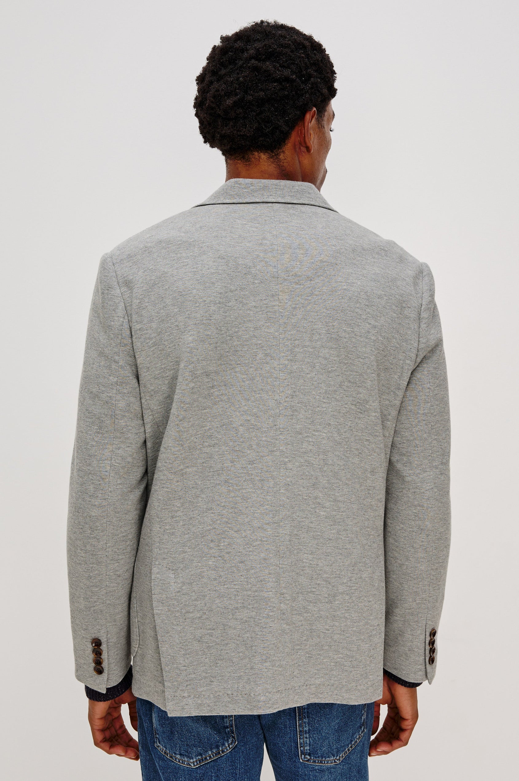 Lorenz Single Breasted Blazer with two patch pockets and one chest pocket in Heather Grey Colorway. Back View Shown on Model.