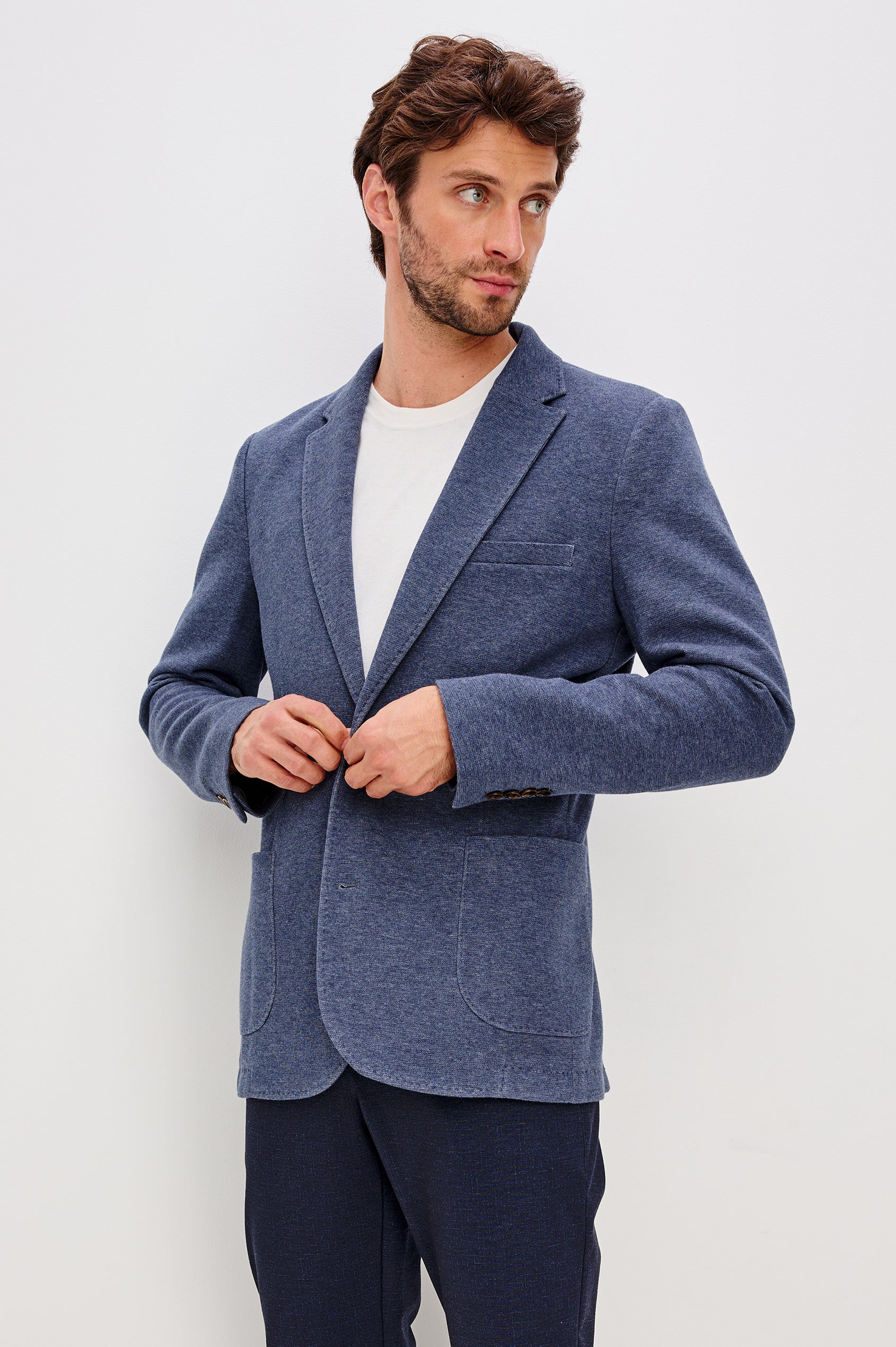 Lorenz Blazer in Nylon With Single Breasted Front Buttons, Single Chest Patch Pocket, Side Patch Pockets, and Long Sleeves in Navy Heather Colorway - Upper Body Front View Featured on Model