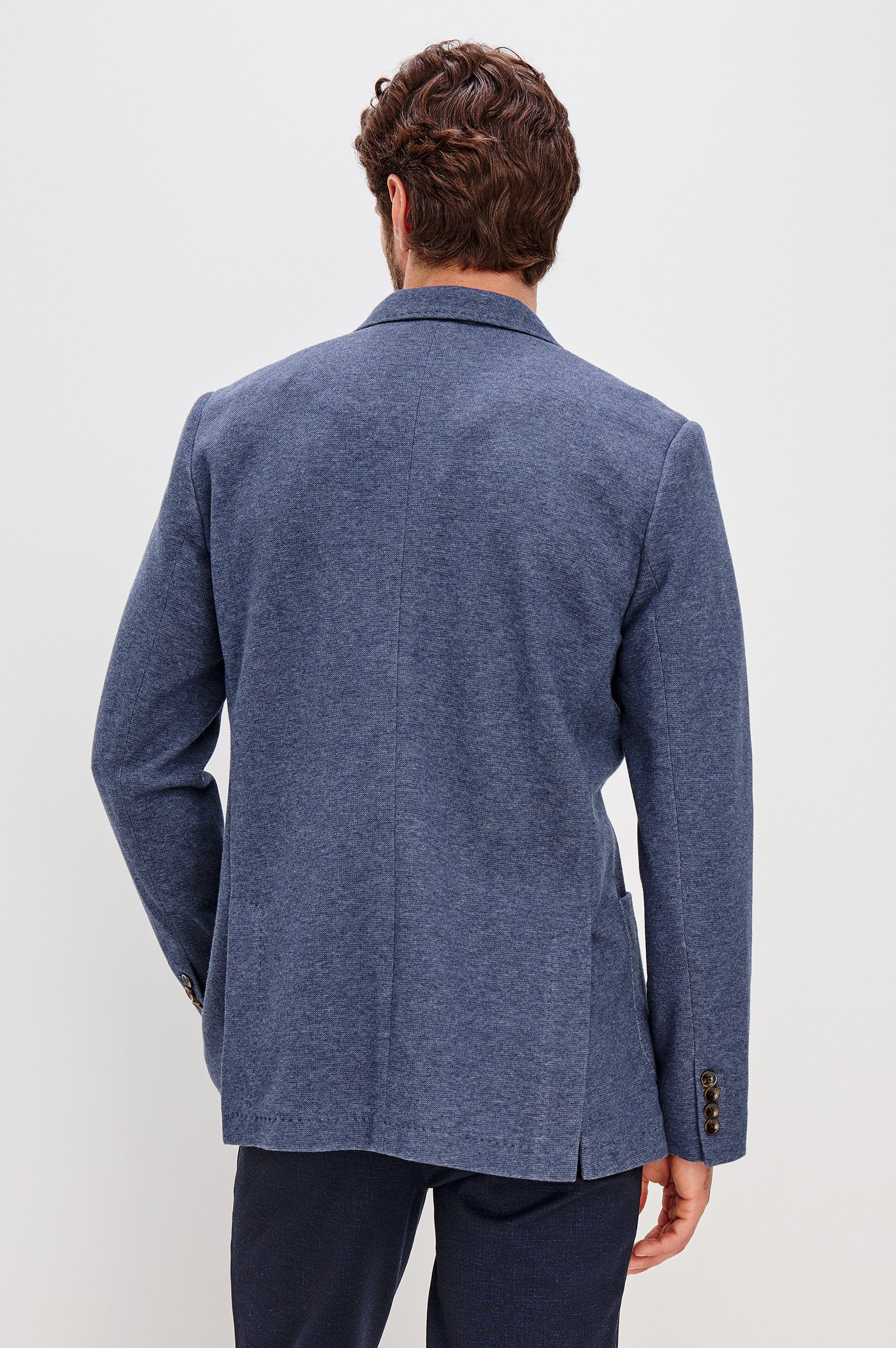 Lorenz Blazer in Nylon With Single Breasted Front Buttons, Single Chest Patch Pocket, Side Patch Pockets, and Long Sleeves in Navy Heather Colorway - Upper Body Back View Featured on Model