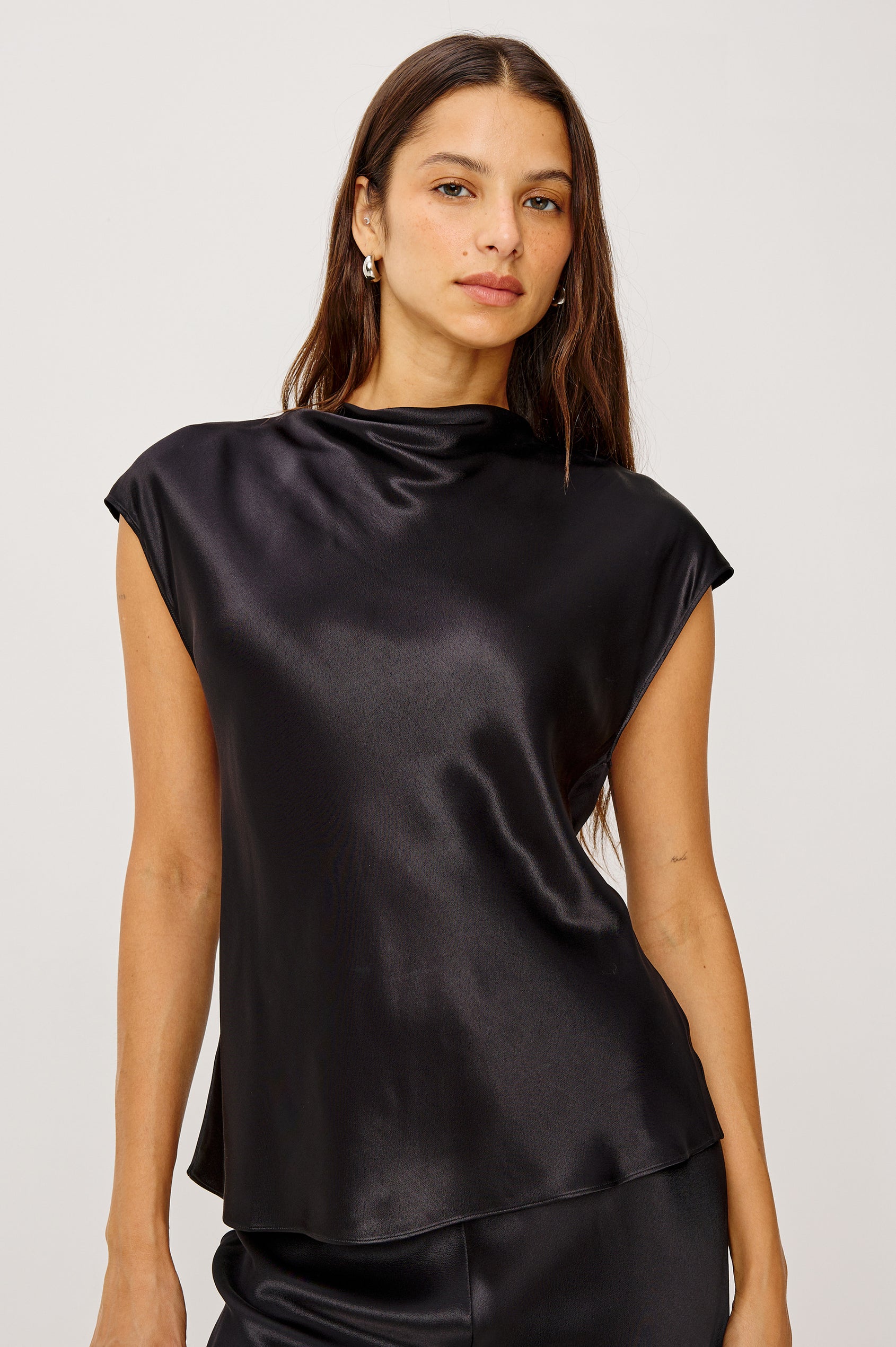 Loretta Top in Satin Back Crepe With a Loose Fit, Cowl Neckline, Cap Sleeves, and a Back Keyhole Button Cutout in Black Colorway - Upper Body Front View Featured on Model