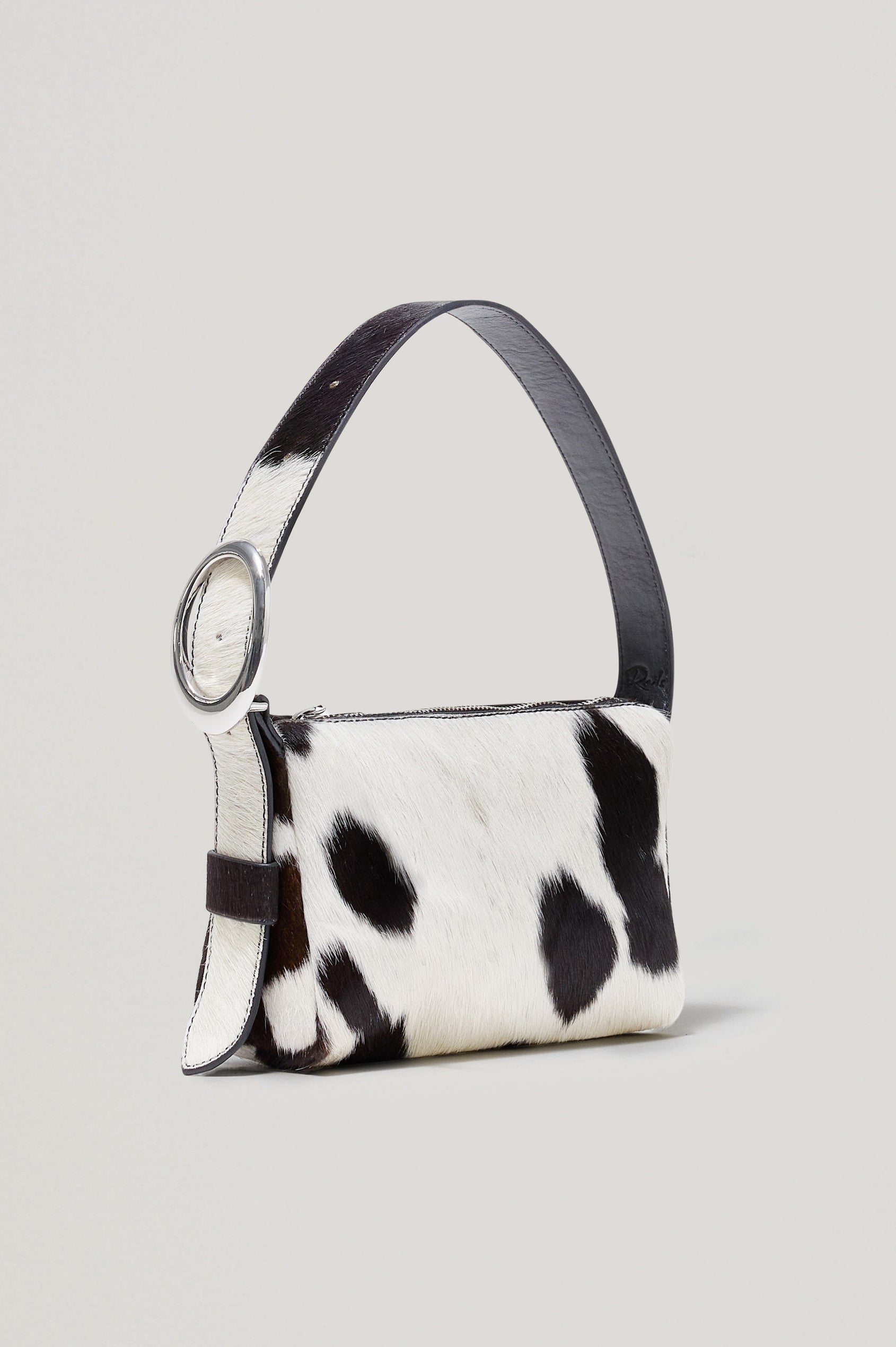 Lucca Shoulder Bag in Calfhair With Adjustable Strap and Polished Silver Buckle, Microsuede Lining, and Snap Button Interior Slip Pocket in Cowgirl Haircalf Colorway - Side View Featured