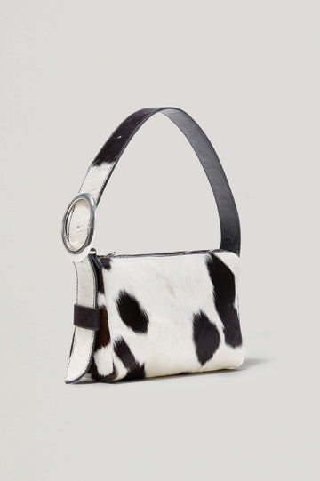 Lucca Shoulder Bag in Calfhair With Adjustable Strap and Polished Silver Buckle, Microsuede Lining, and Snap Button Interior Slip Pocket in Cowgirl Haircalf Colorway - Side View Featured