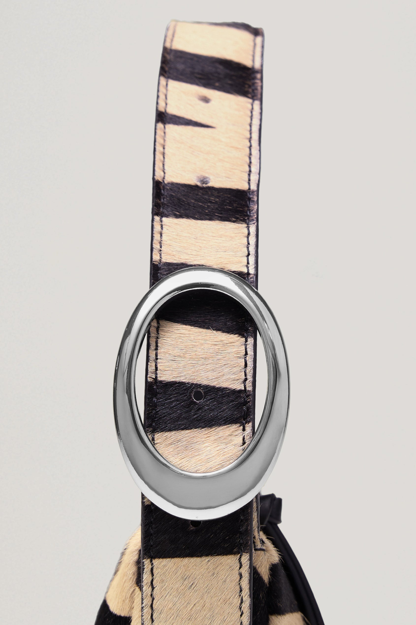 Lucca Shoulder Bag in Calfhair With Adjustable Strap and Polished Silver Buckle, Microsuede Lining, and Snap Button Interior Slip Pocket in Zebra Haircalf Colorway - Front View Featured