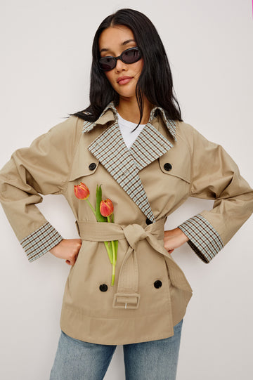 Lucien Trench Jacket in Garbardine With Notched Lapels, Wide 3/4 Sleeves, Double Breasted Buttons, Adjustable Belt, and Contrast Lining in Sand - Upper Body Front View Featured on Model