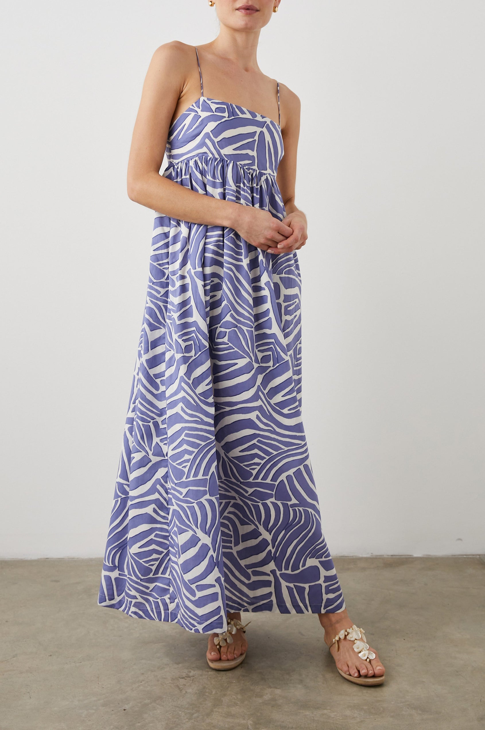 Lucille Sleeveless Maxi Dress with Adjustable Spaghetti Straps, a Square Neckline, and Shirring at the Back in Island Waves Colorway, a Purple and White Print - Front Full Body View Featured on Model  
