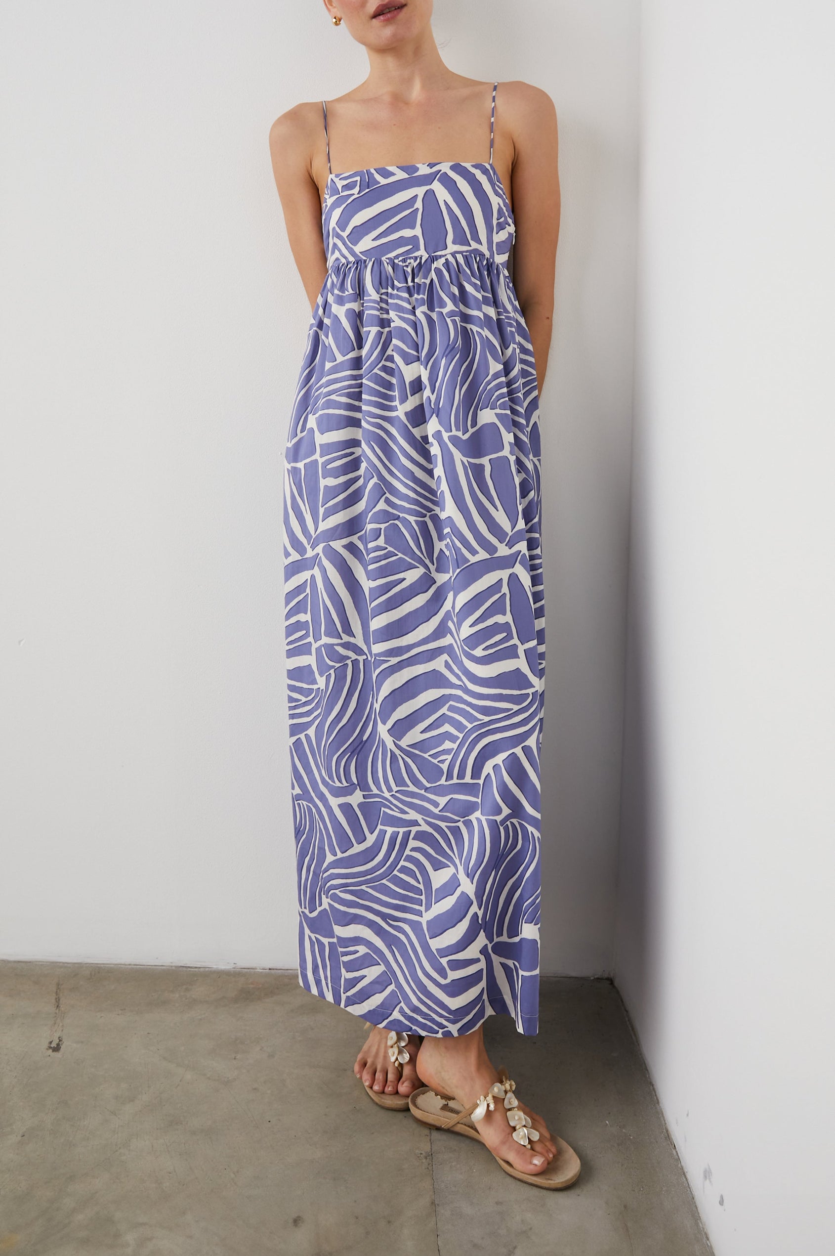 Lucille Sleeveless Maxi Dress with Adjustable Spaghetti Straps, a Square Neckline, and Shirring at the Back in Island Waves Colorway, a Purple and White Print - Front Full Body View Featured on Model  