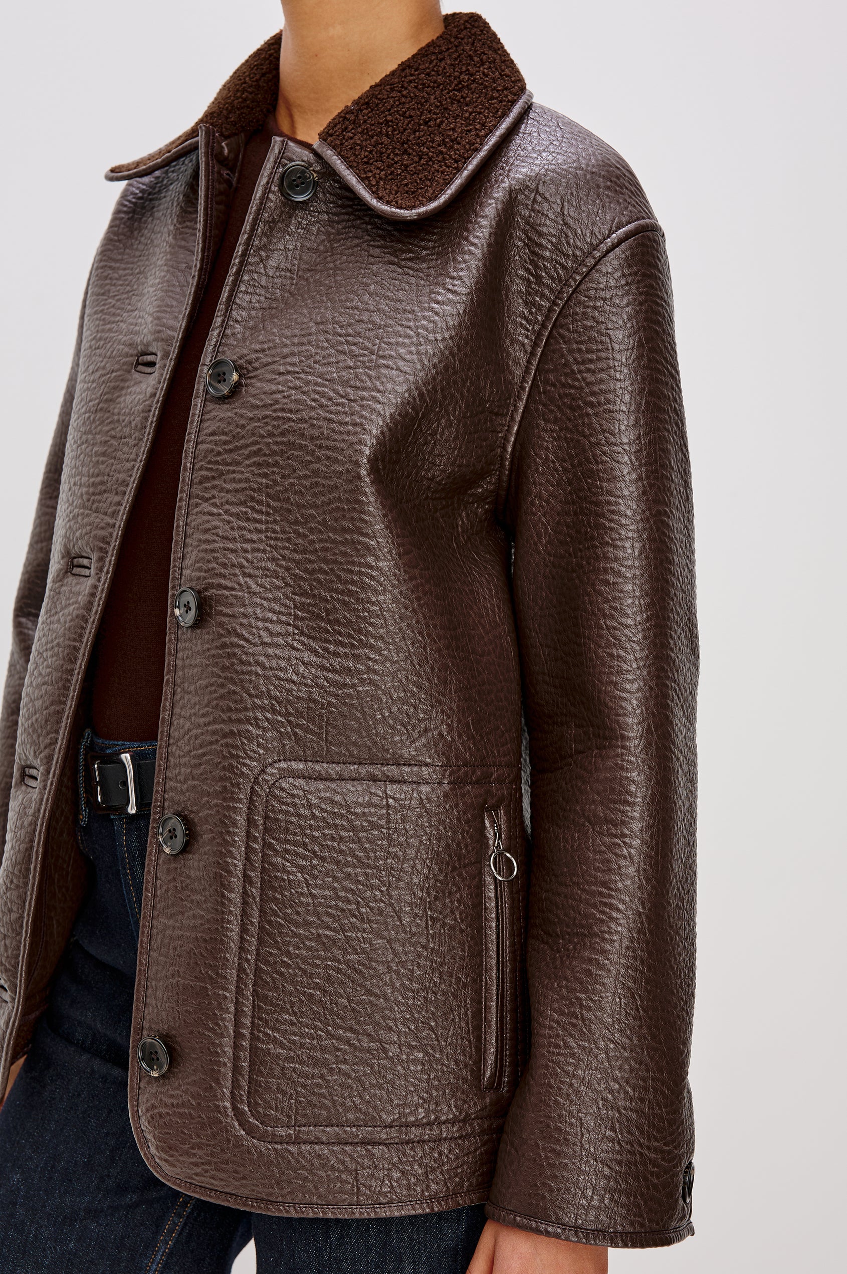 Leah Jacket in Vegan Pebbled Leather With Plush Faux Shearling Collar and Lining, Front Buttons, Zippered Side Pockets With O-Ring Pulls in Walnut Colorway - Upper Body Close Up Front View Featured on Model