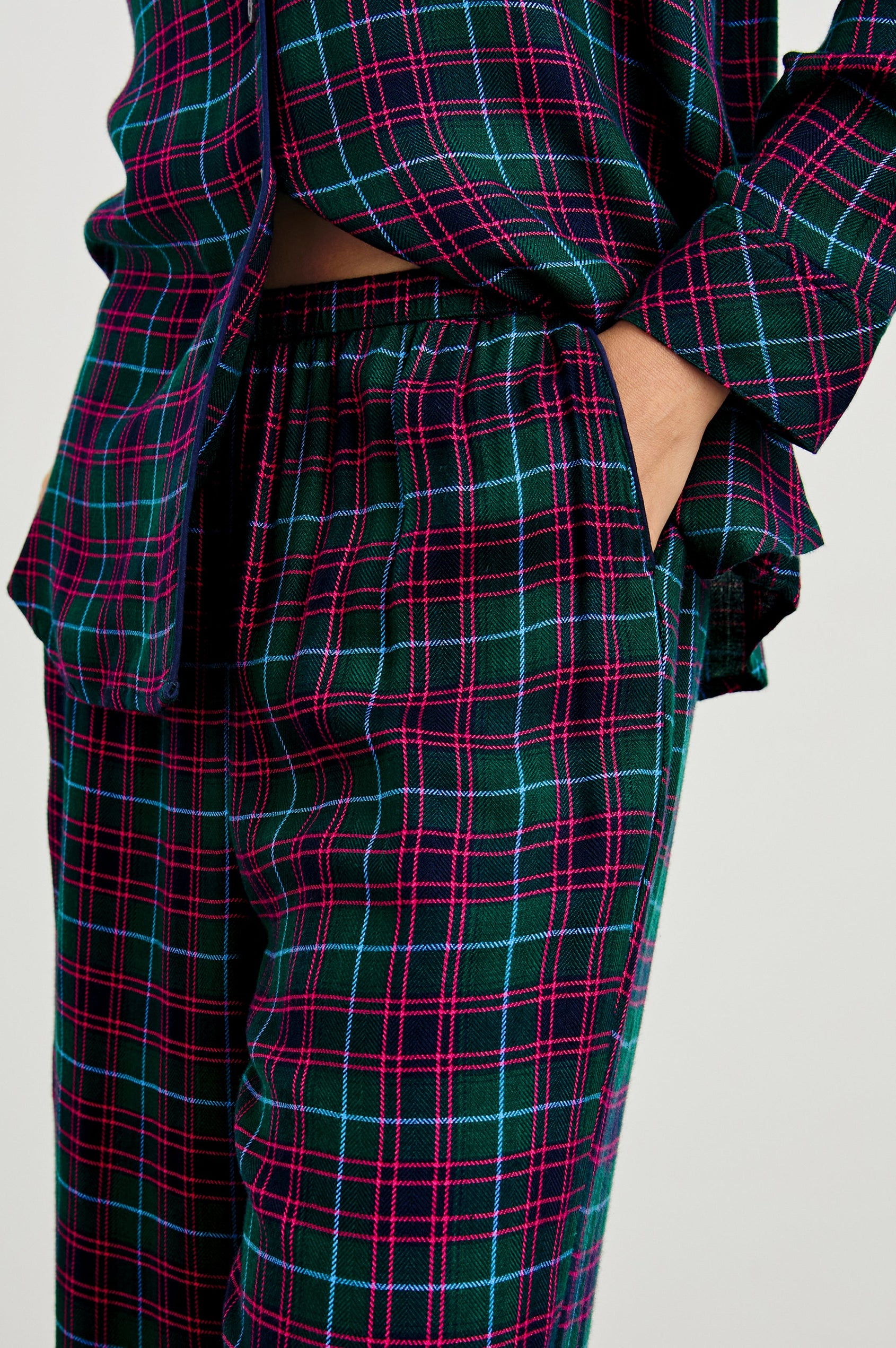 Luna Pajama Set with a Long Sleeve, Button Up, V Neck Top with a Chest Patch Pocket and Pants with Two Front Pockets in Evergreen Fuchsia Ice Colorway, a plaid - Front View Featured on Model  
