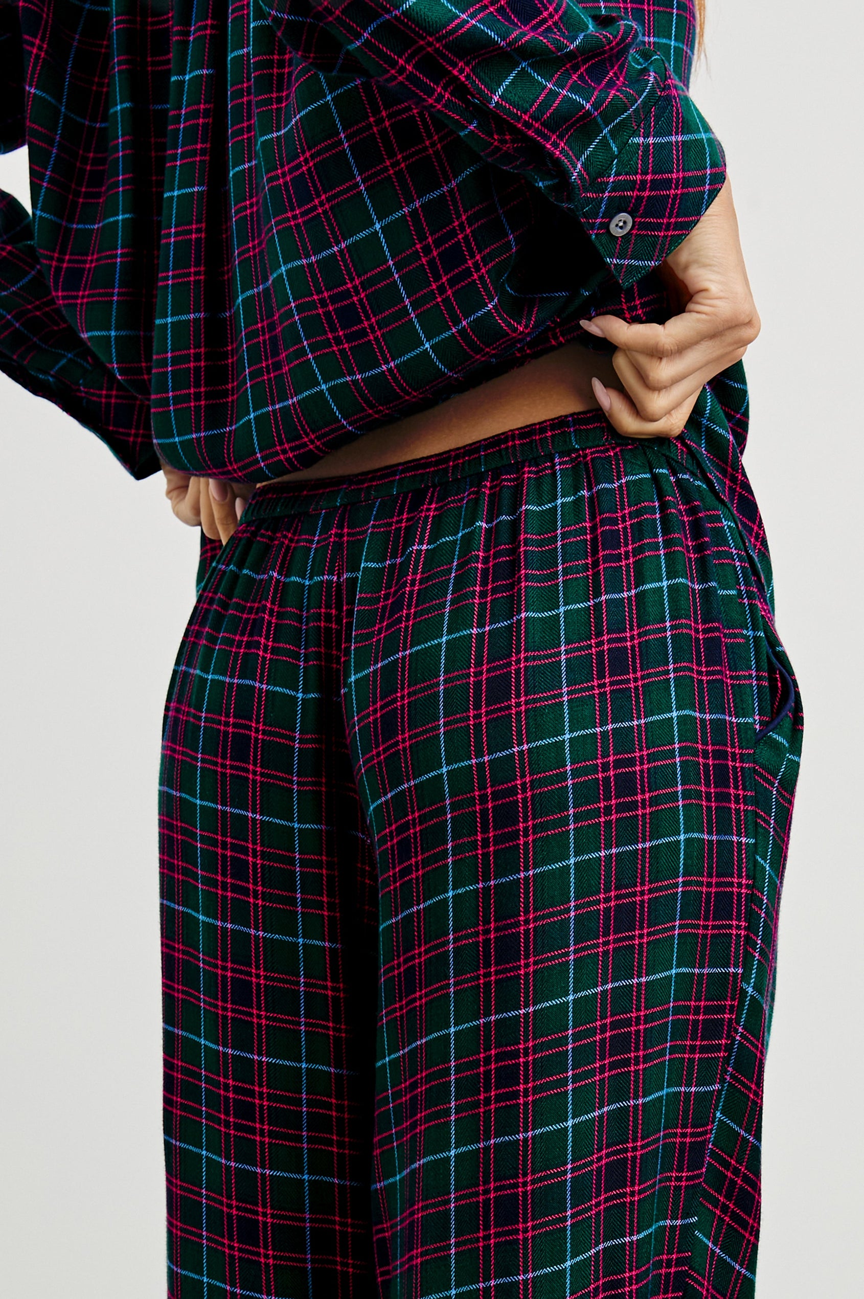 Luna Pajama Set with a Long Sleeve, Button Up, V Neck Top with a Chest Patch Pocket and Pants with Two Front Pockets in Evergreen Fuchsia Ice Colorway, a plaid - Back View Featured on Model  