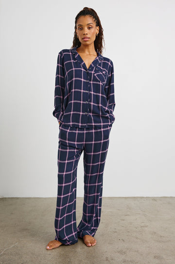 Luna Pajama Set with a Long Sleeve, Button Up, V Neck Top with a Chest Patch Pocket and Pants with Two Front Pockets in Sapphire Magenta Colorway, a plaid - Front Full Body View Featured on Model  
