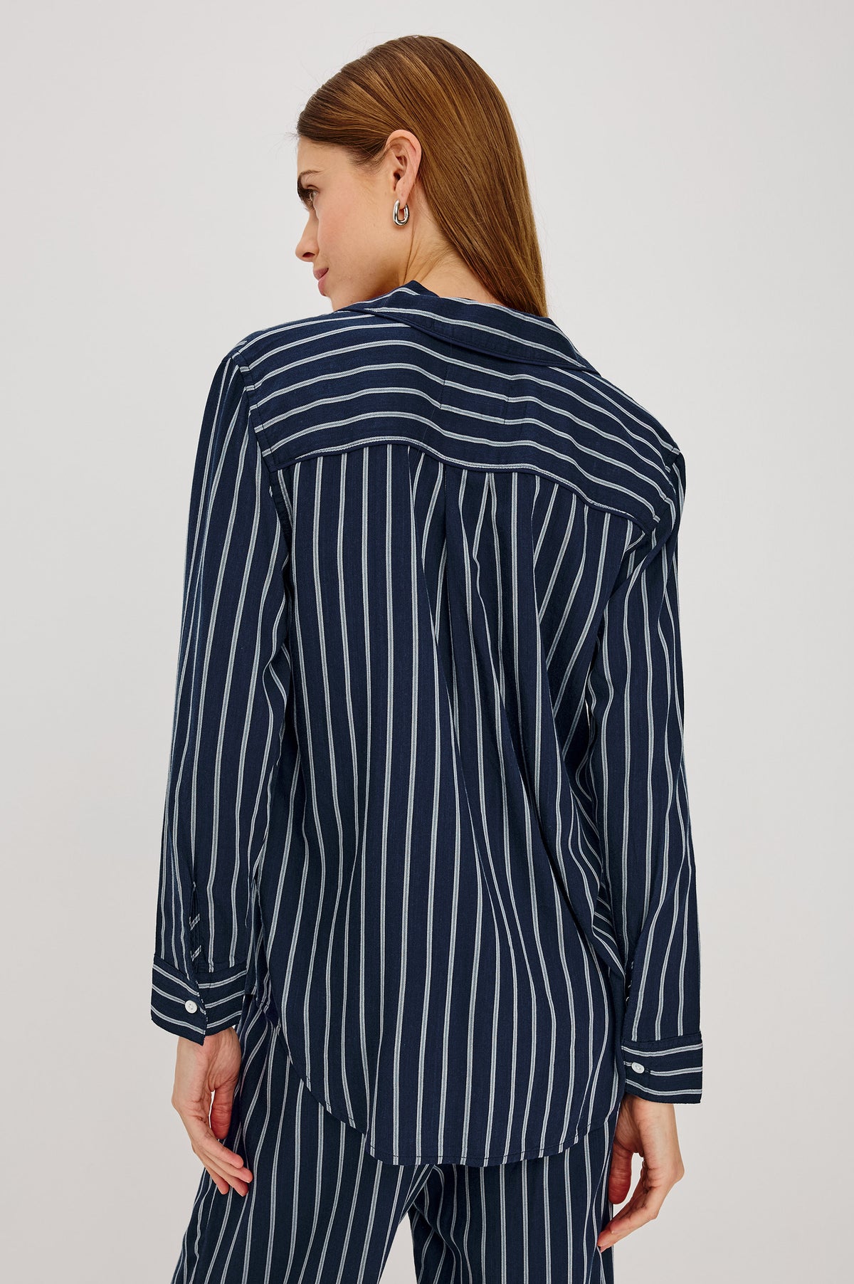 Luna Pajama Set in Signature Rayon With Piping, Button-Up Shirt, Matching Pants, and Relaxed Fit in Navy Sky Stripe Colorway - Upper Body Back View Featured on Model