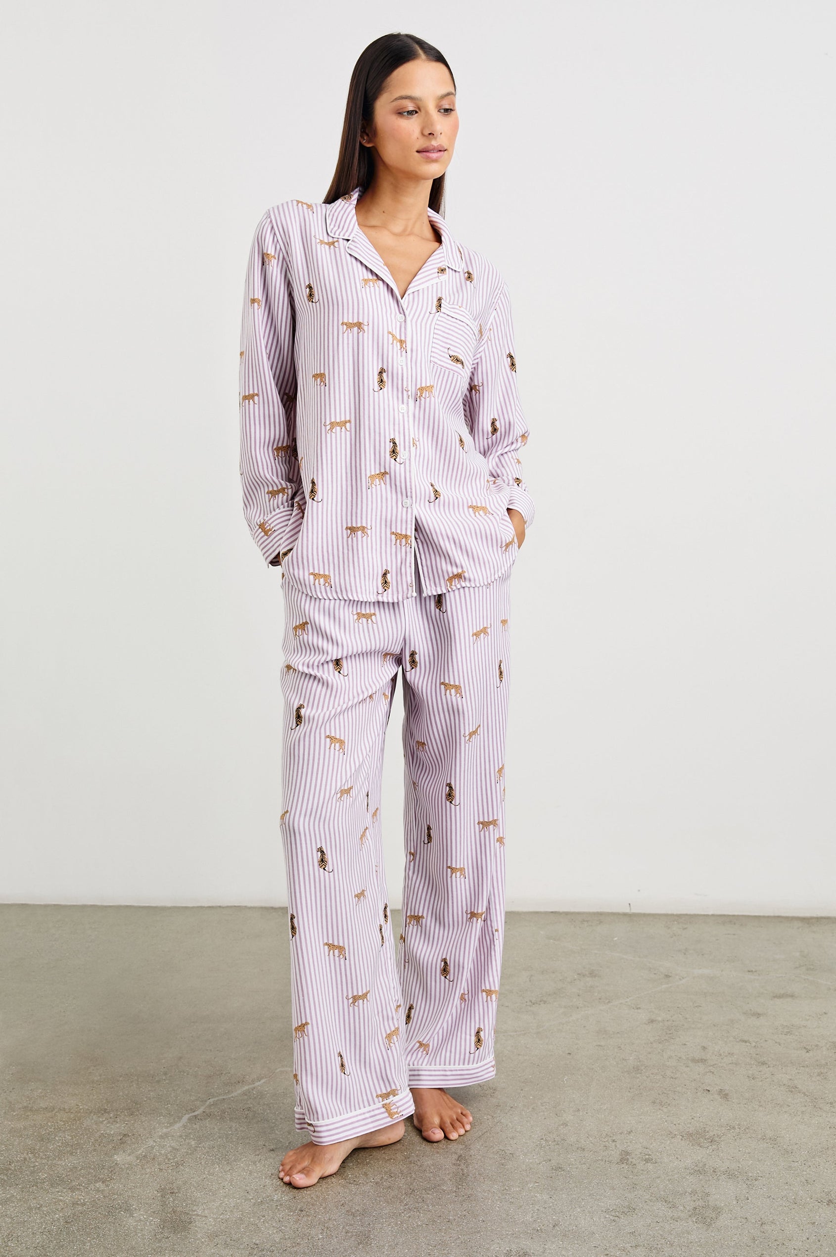 Luna Pajama Set with a Long Sleeve, Button Up, V Neck Top with a Chest Patch Pocket and Pants with Two Front Pockets in Rose Stripe Cats Colorway, Gold Wildcats on Rose and White Vertical Stripes - Front Full Body View Featured on Model  