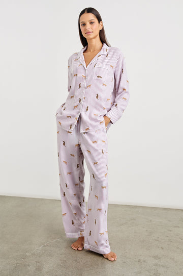 Luna Pajama Set with a Long Sleeve, Button Up, V Neck Top with a Chest Patch Pocket and Pants with Two Front Pockets in Rose Stripe Cats Colorway, Gold Wildcats on Rose and White Vertical Stripes - Front Full Body View Featured on Model  