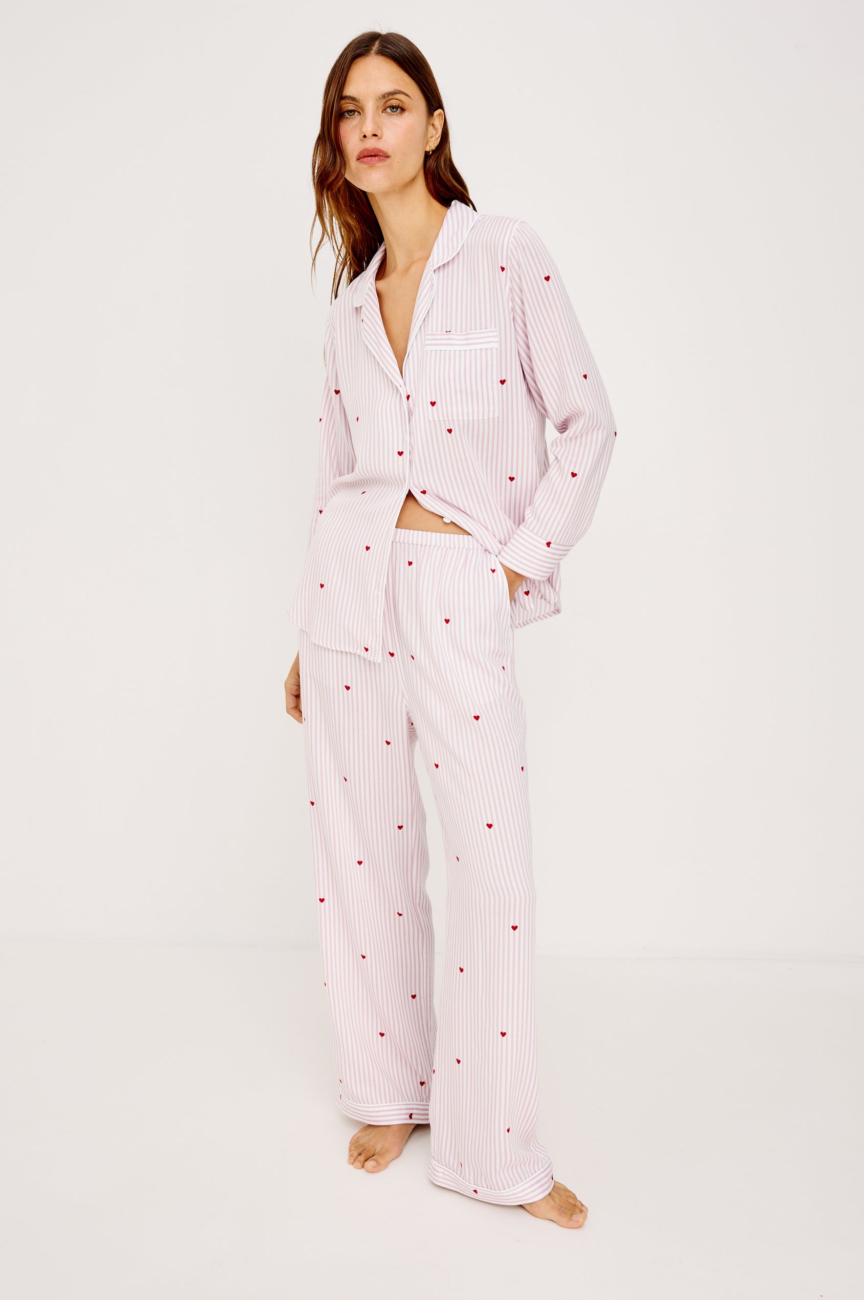 Luna Pajama Set in Signature Rayon With Button-Up Collared Shirt With Front Buttons, Long Sleeves, Chest Patch Pocket and Matching Pant With Side Pockets and Drawstring Waist Ties in Rose Stripe Hearts Colorway - Full Body Front View Featured on Model