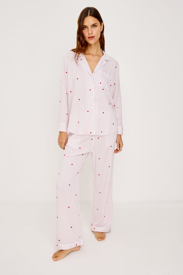 Luna Pajama Set in Signature Rayon With Button-Up Collared Shirt With Front Buttons, Long Sleeves, Chest Patch Pocket and Matching Pant With Side Pockets and Drawstring Waist Ties in Rose Stripe Hearts Colorway - Full Body Front View Featured on Model