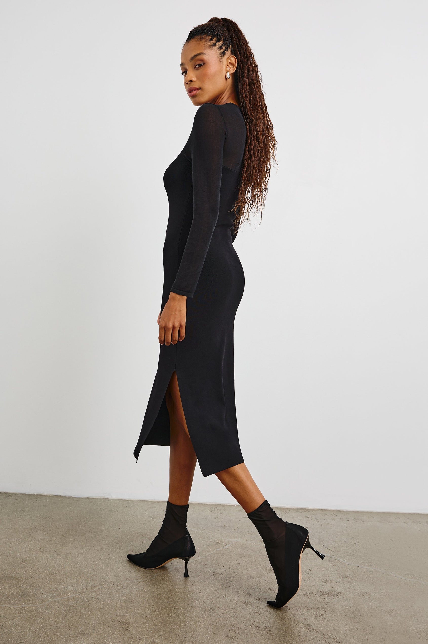 Luz Long-Sleeve Midi Dress with Transparent Yoke and Sleeves and Mid-Thigh Side Slit in Black Colorway - Side Full Body View Featured on Model