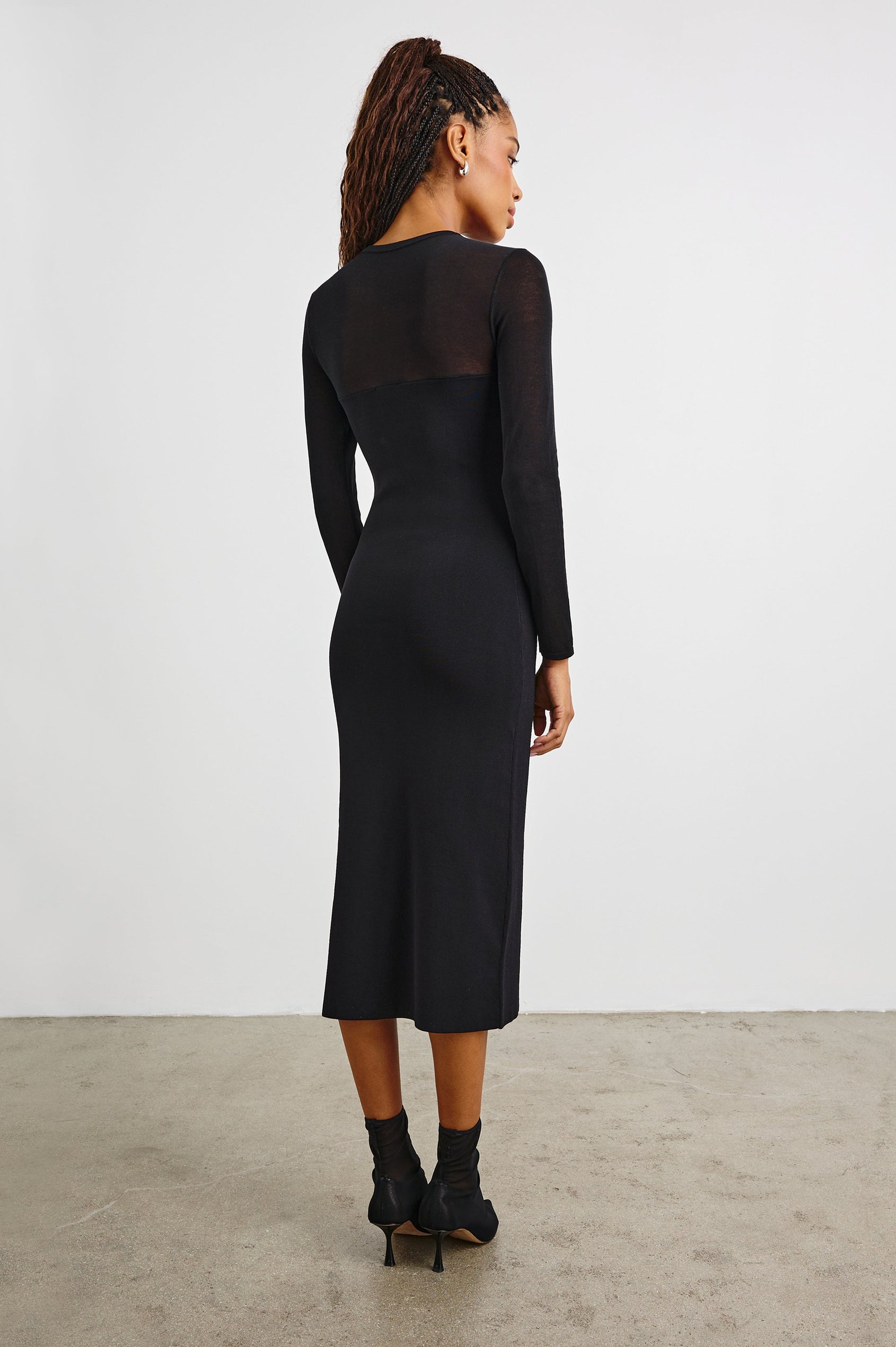 Luz Long-Sleeve Midi Dress with Transparent Yoke and Sleeves and Mid-Thigh Side Slit in Black Colorway - Back Full Body View Featured on Model