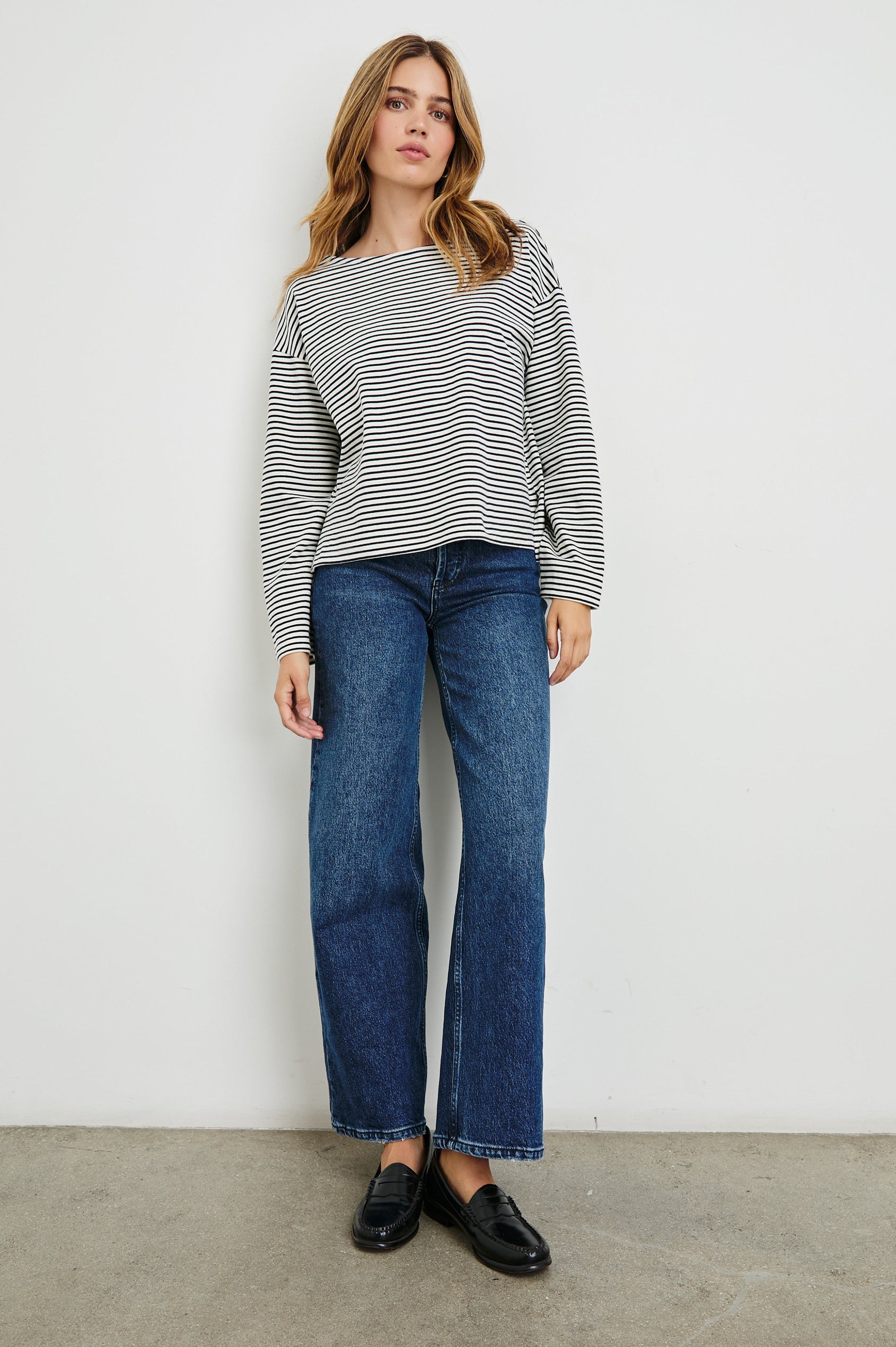 Macy Long-Sleeved Top with Boatneck and Two Short Side Slits at the Hem in Ivory Navy Stripe Colorway, Horizontal Stripes - Front View Featured on Model