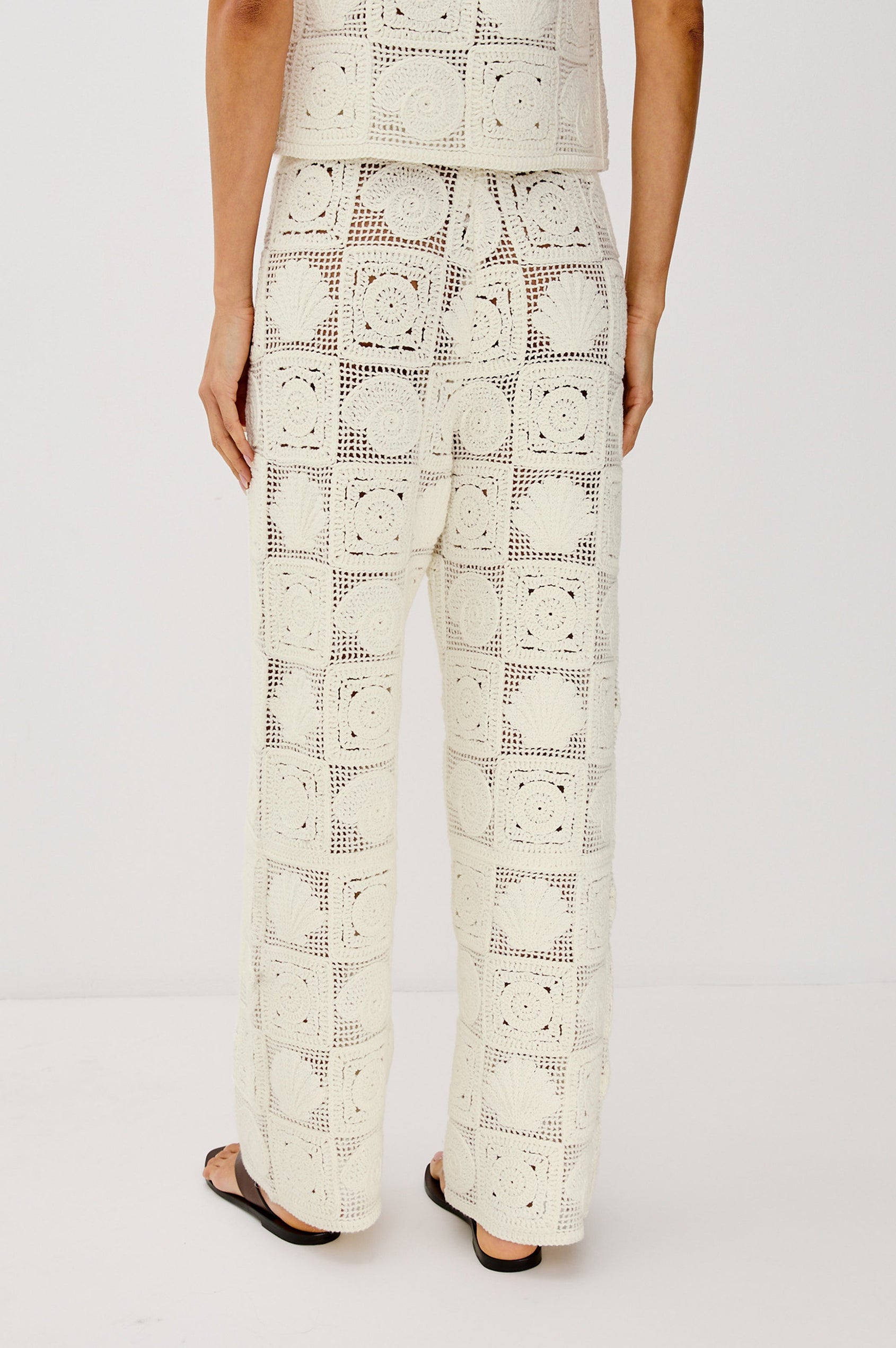 Maja Straight Leg Pant with Ribbed Drawstring Waistband in White Sea Shell Crochet Colorway. Back View Shown on Model.