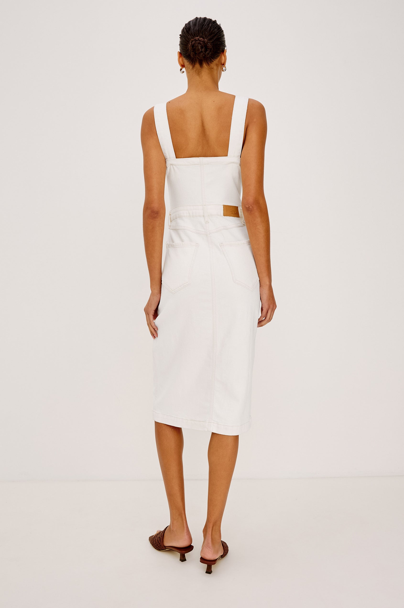 Malibu Sleeveless Denim Midi Dress with Shoulder Straps, Buttons Down the Front, a Square Neckline in the Front and Back, Two Front Pockets and Two Back Patch Pockets in Vintage Ecru Colorway - Back Full Body View Featured on Model