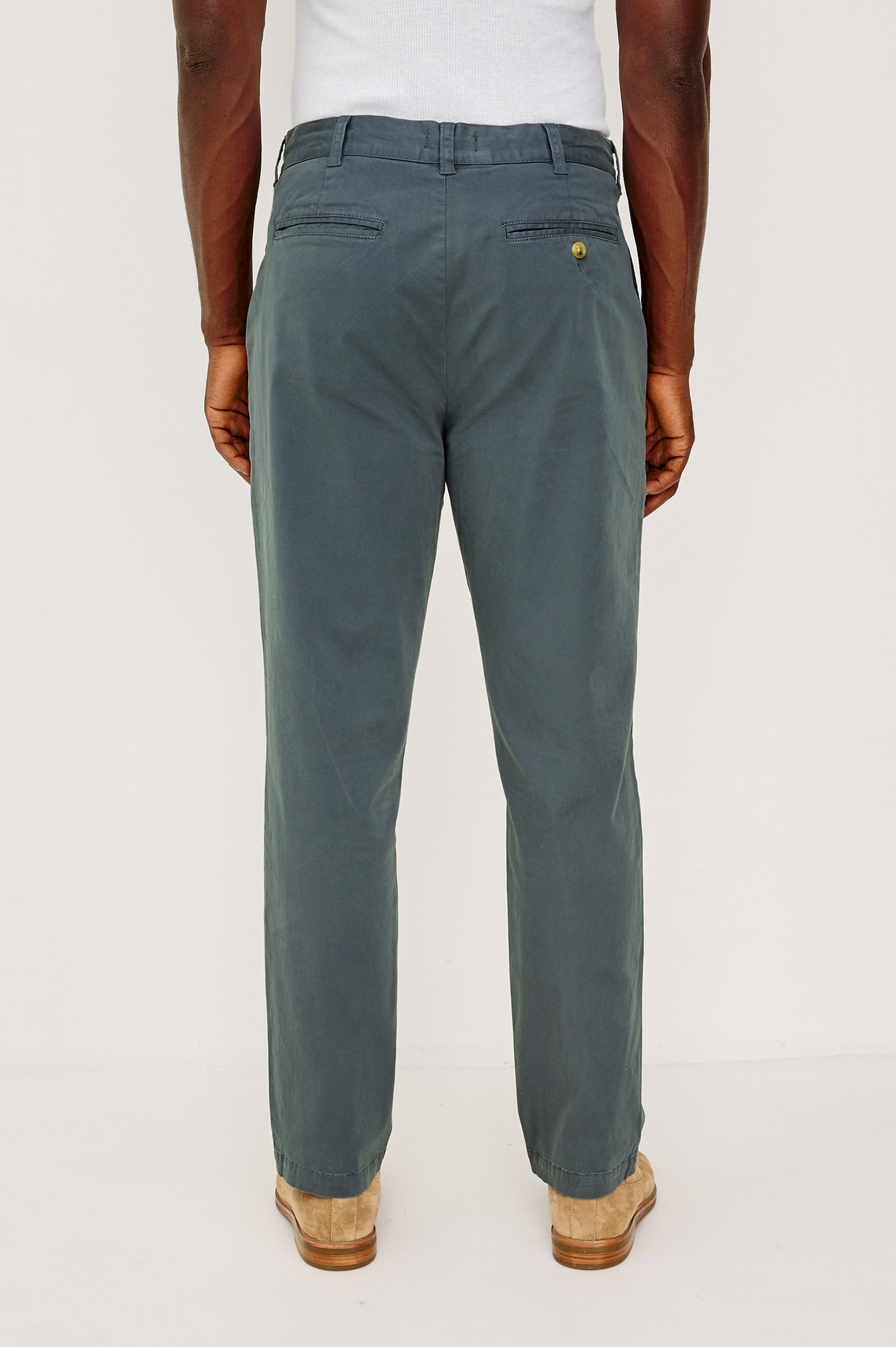 Marcellus Pants with Belt Loops, Two Seam Front Pockets, a Front Buttoned Flap Pocket, a Back Buttoned Welt Pocket and a Back Welt Pocket in Faded Blue Colorway - Back View Featured on Model