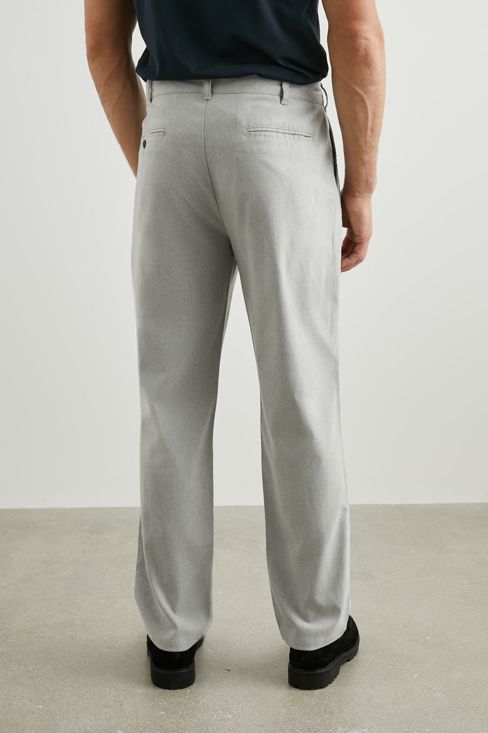 Marcellus Pants with Belt Loops, Two Seam Front Pockets, a Front Buttoned Flap Pocket, a Back Buttoned Welt Pocket and a Back Welt Pocket in Soft Grey Melange Colorway - Back View Featured on Model 