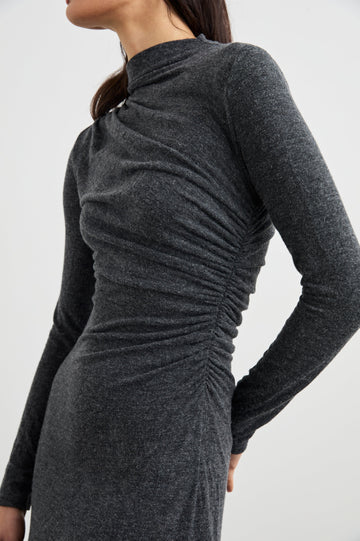 Margaret Long-Sleeve Midi Dress with a Mock Neck and Shirring along the Left Side in Charcoal Colorway - Side View Featured on Model