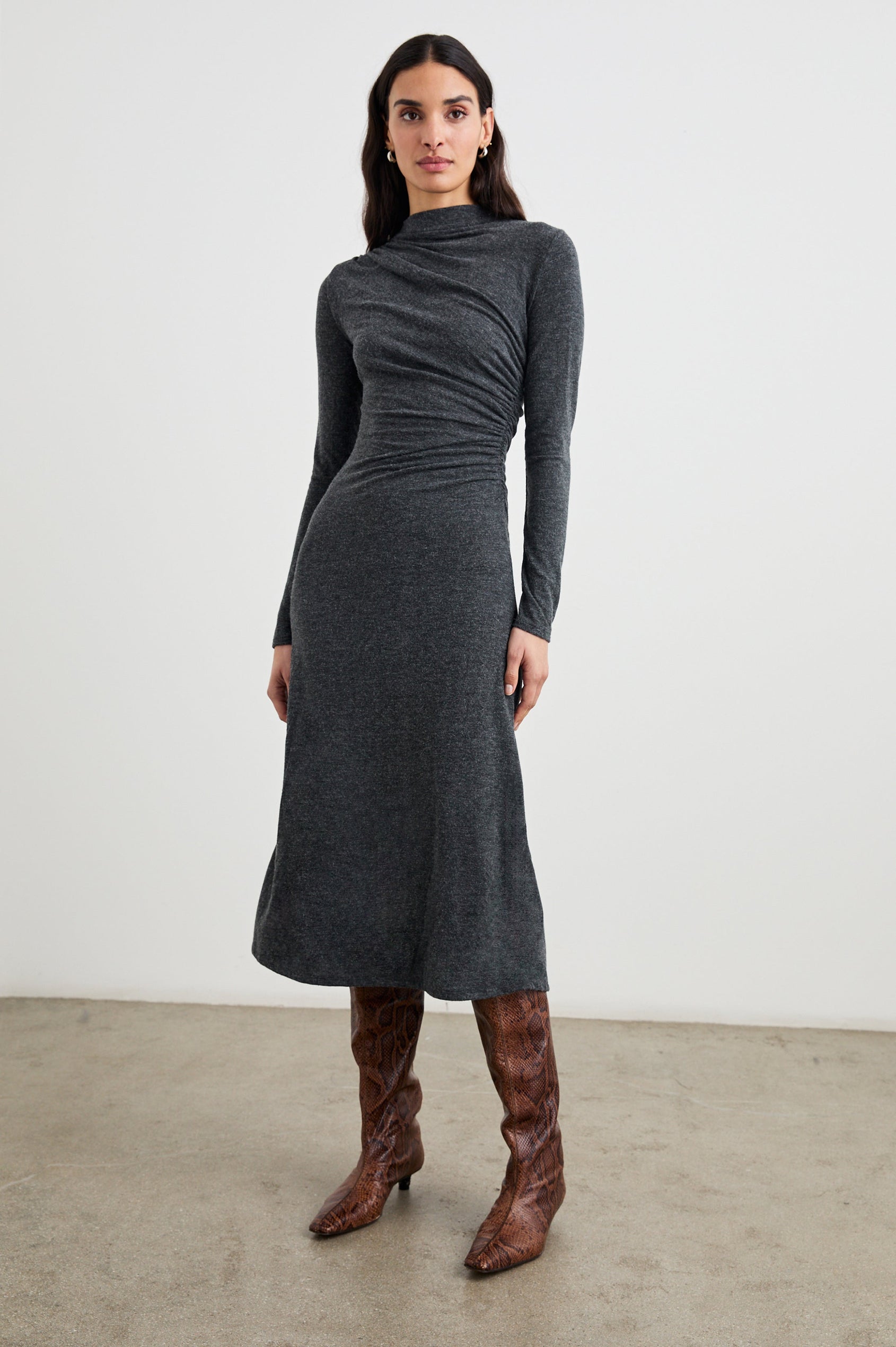 Margaret Long-Sleeve Midi Dress with a Mock Neck and Shirring along the Left Side in Charcoal Colorway - Front Full Body View Featured on Model
