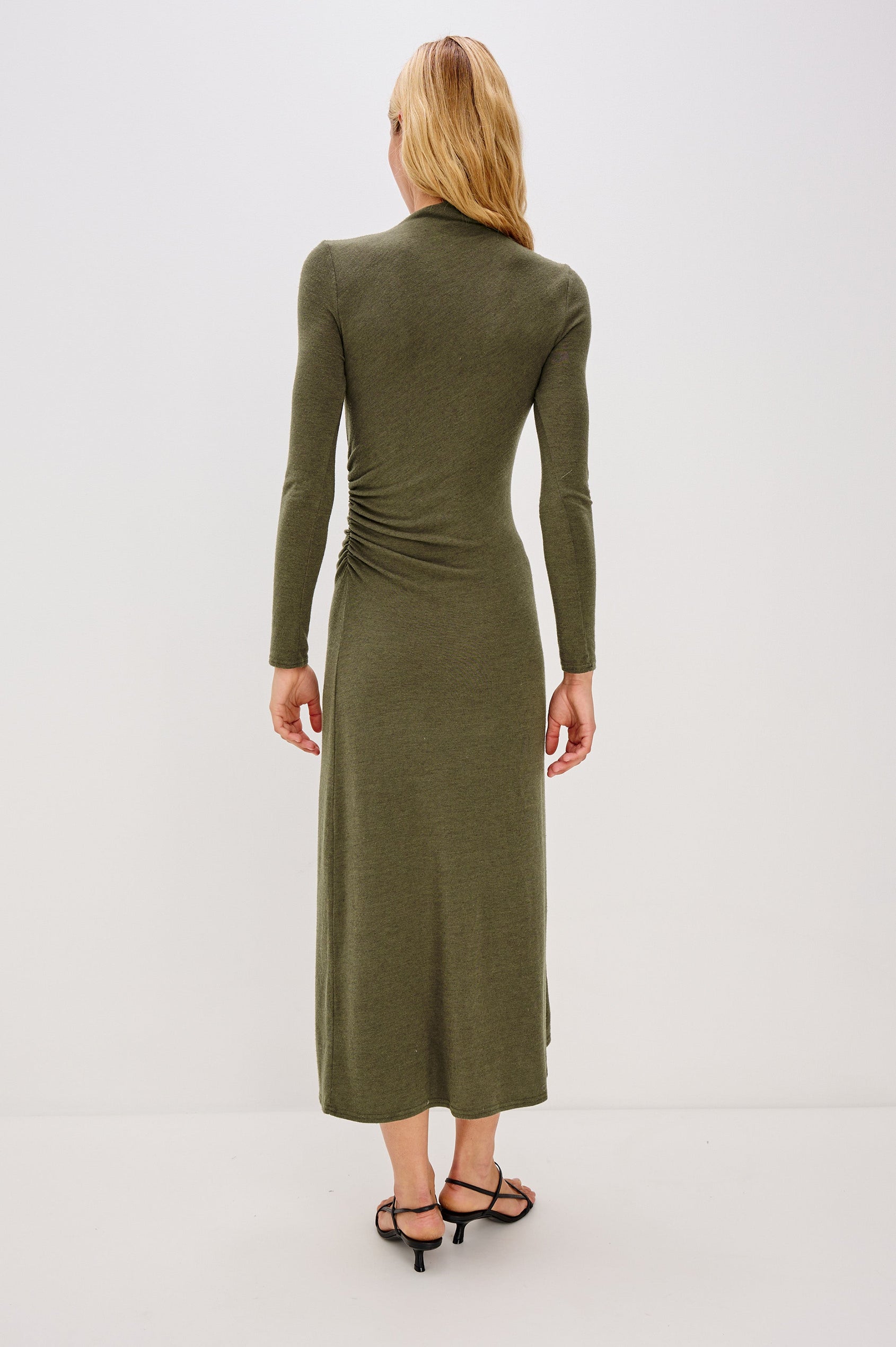 Margaret Long-Sleeve Midi Dress with a Mock Neck and Shirring along the Left Side in Heather Olive Colorway - Back View Featured on Model