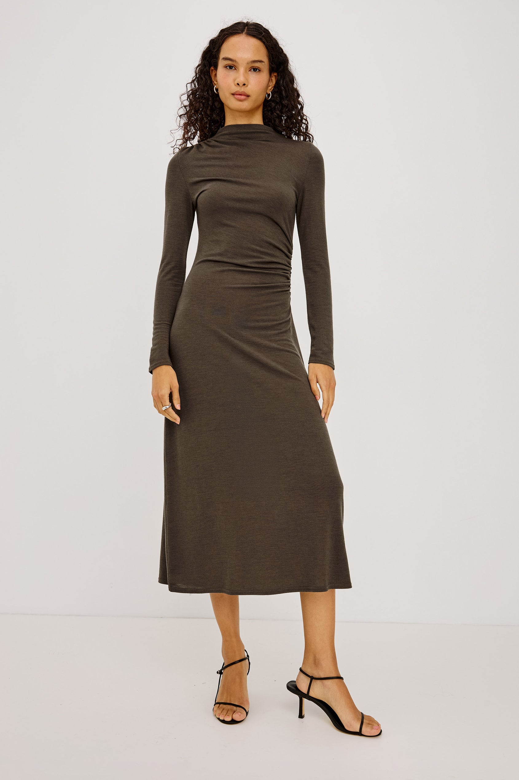 Margaret Midi Dress in Brushed Tissue Jersey With Mock Neck, Long Sleeves, Ruched Sides, and Fitted Silhouette in Heather Olive Colorway - Full Body Front View Featured on Model