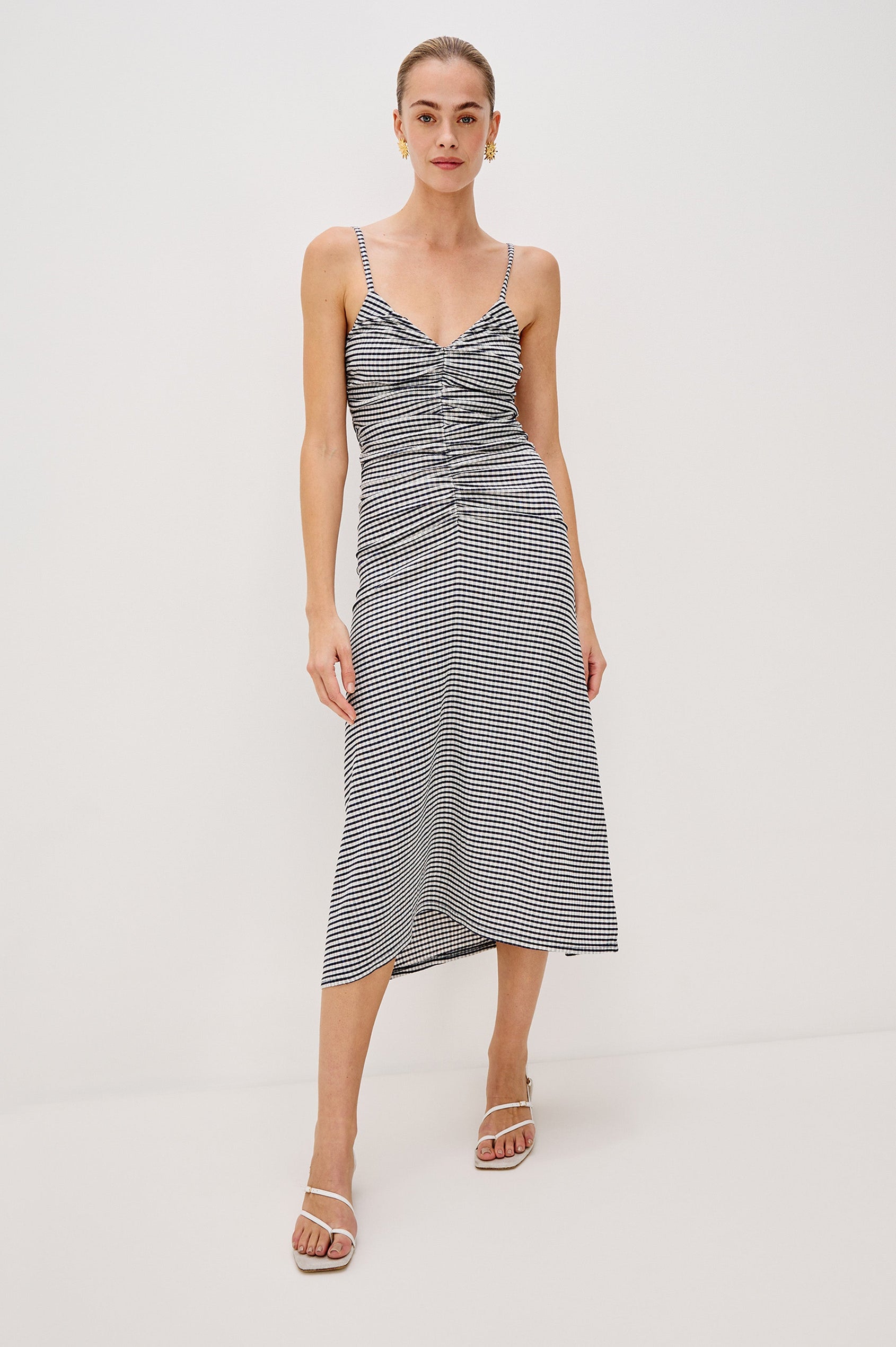 Mari Midi Dress with Spaghetti Straps, V-Front, A-Line Silhouette and Gathering Down Center Front in Navy Gingham Colorway. Full Body Front View Shown on Model.