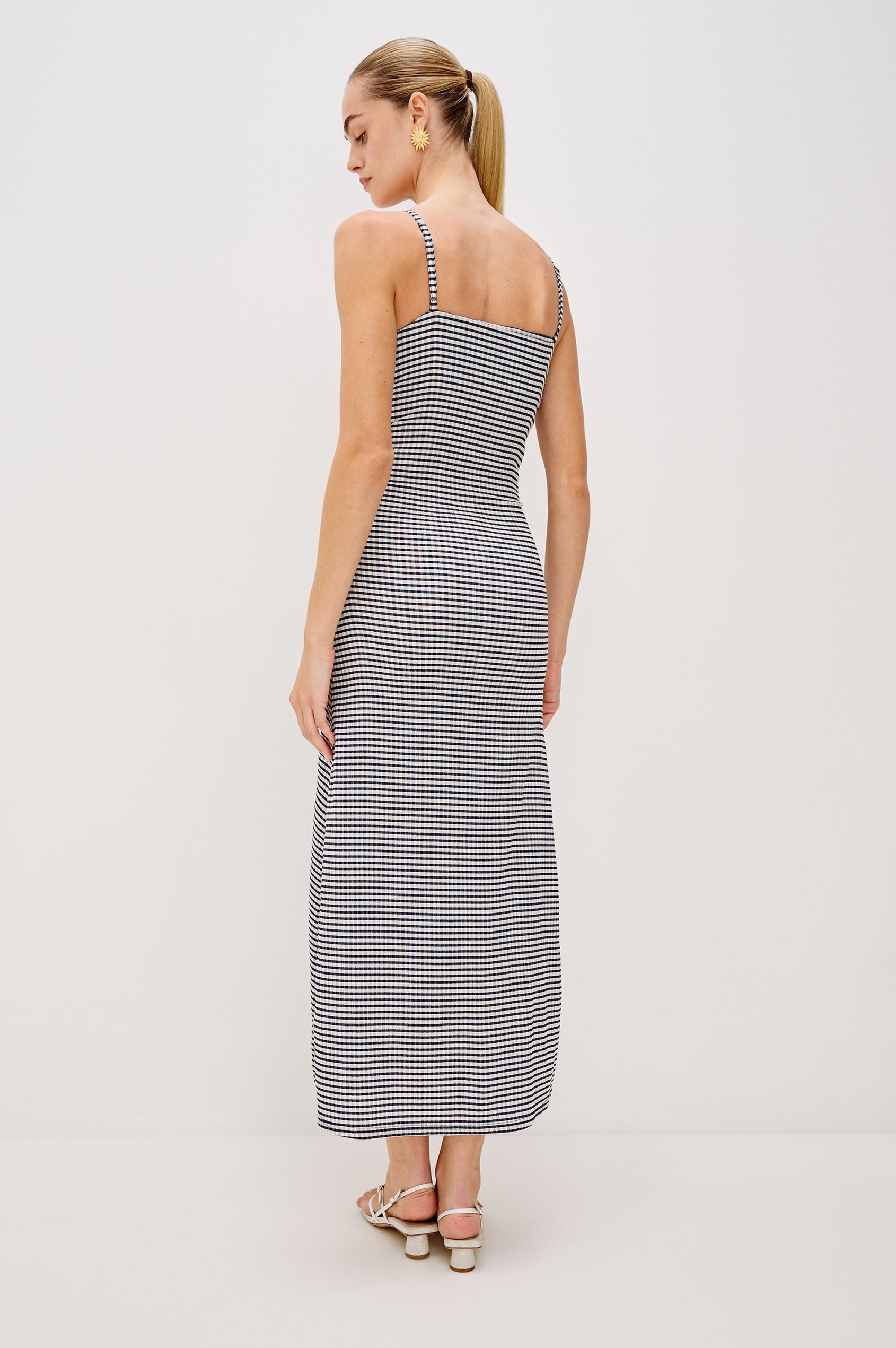 Mari Midi Dress with Spaghetti Straps, V-Front, A-Line Silhouette and Gathering Down Center Front in Navy Gingham Colorway. Full Body Back View Shown on Model.