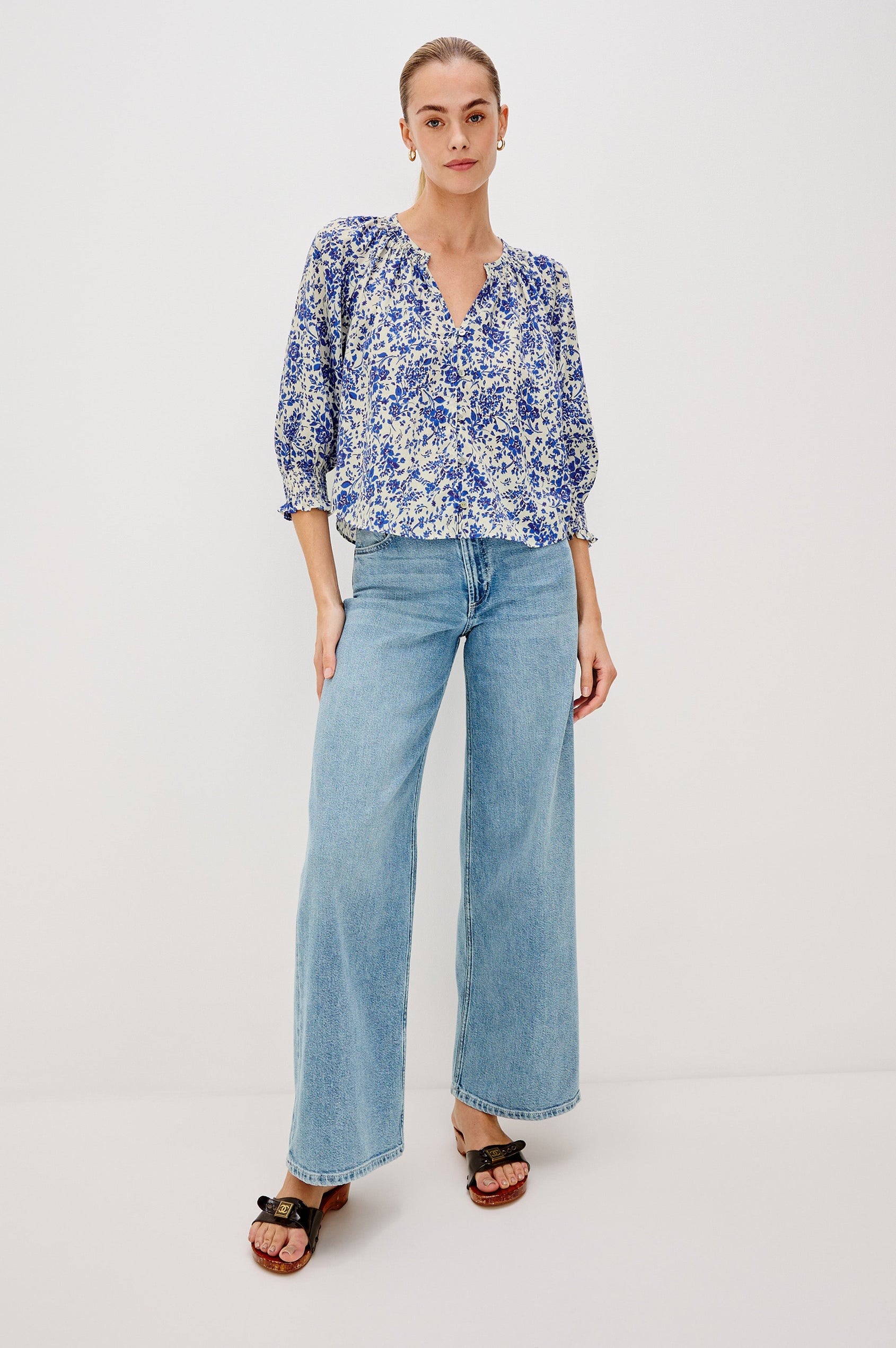 Mariah Button Down Shirt With 3/4" Length Sleeves with Elastic Smoking at Sleeve Hem, V-Neck and Half Button Front in Blue Marguerite Colorway - Full Body Front View Featured on Model.