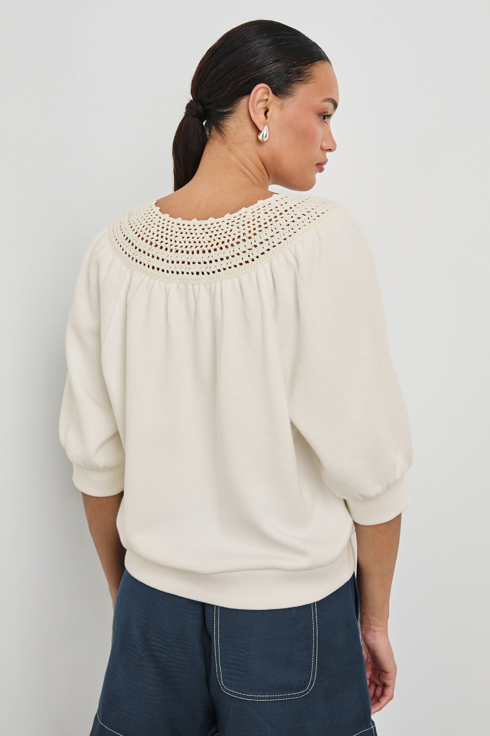 Mariposa Relaxed Fit Top with Elbow Length Sleeves, Tonal Embroidery Details Along Split Neckline in Ivory Colorway.  Back View Shown on Model.