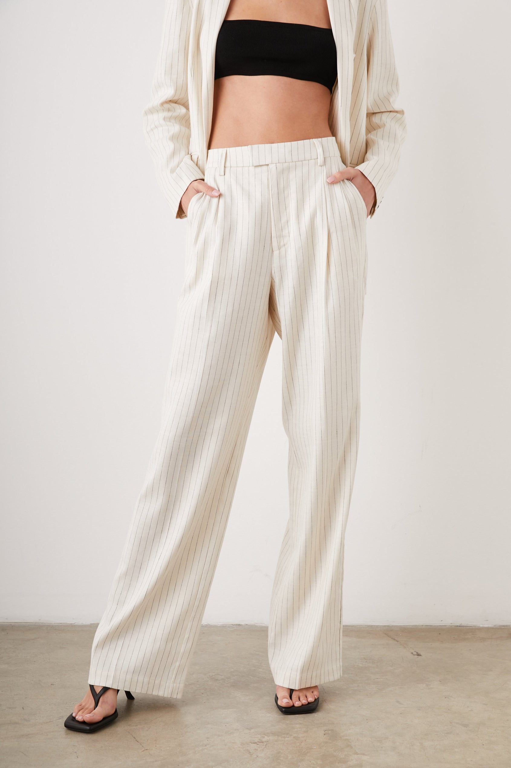 Marnie Pants with Concealed Closure, Belt Loops, Two Front Pockets and Two Back Welt Pockets in Ivory Pinstripe Colorway- Front View Featured on Model 