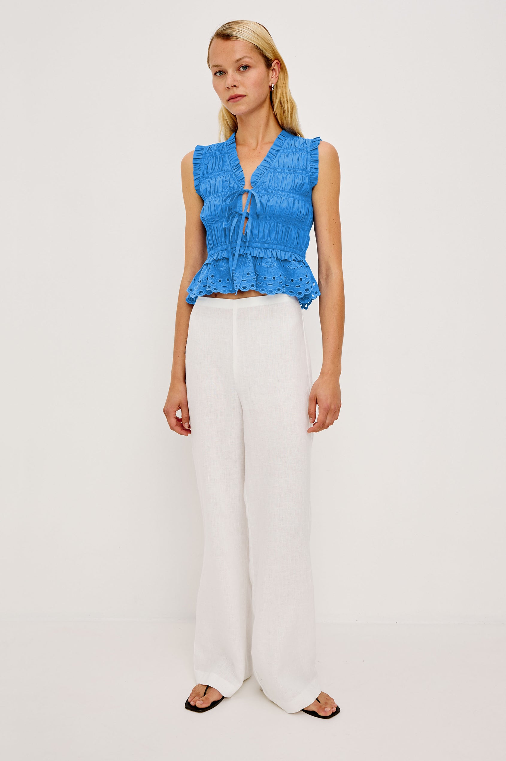Martine Cropped Sleeveless Top in Heavy Cotton Poplin With Plunging V-Neckline With Adjustable Ties and Ruffle Trim in Harbor Blue Colorway - Full Body Front View Featured on Model