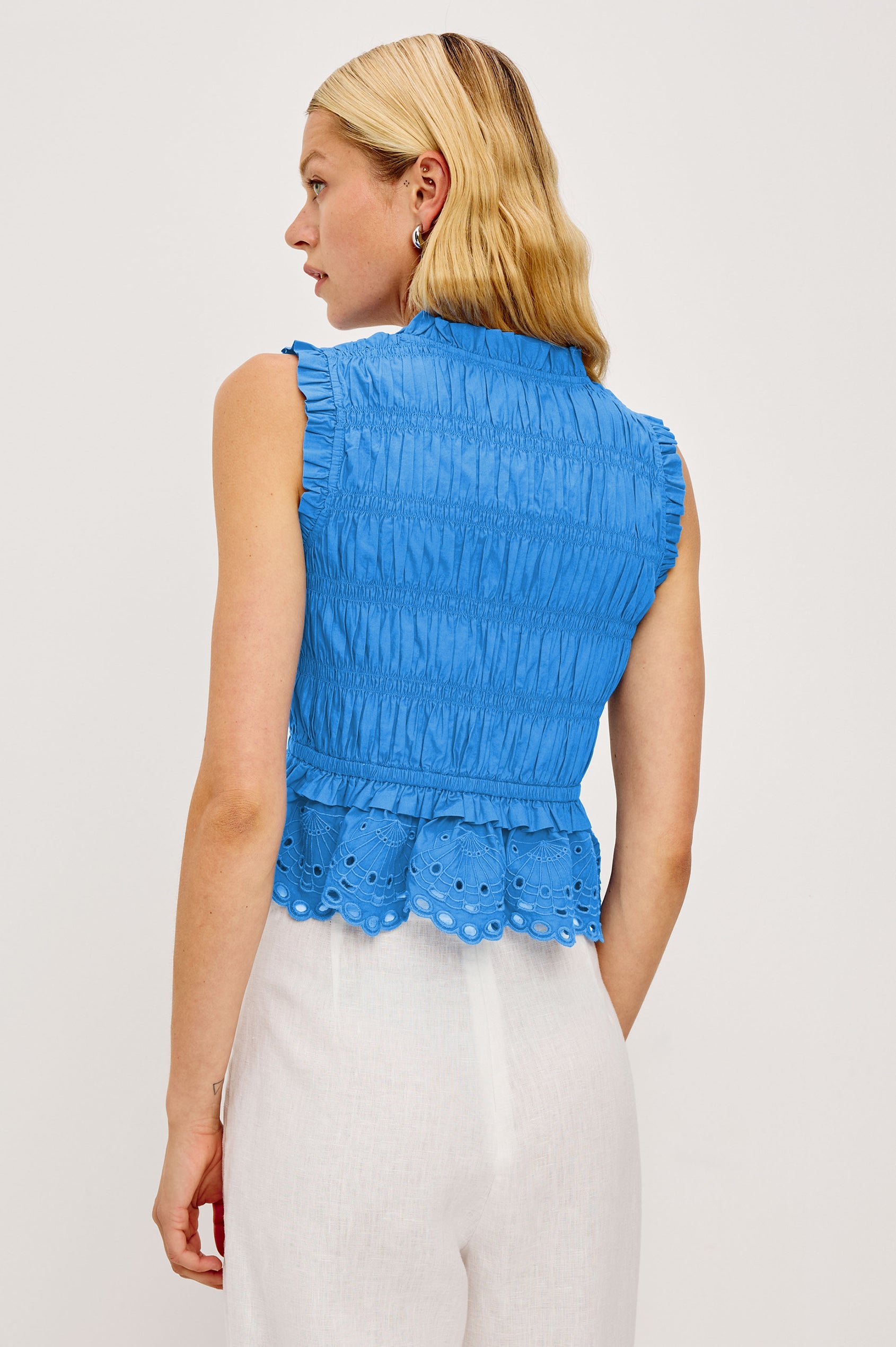 Martine Cropped Sleeveless Top in Heavy Cotton Poplin With Plunging V-Neckline With Adjustable Ties and Ruffle Trim in Harbor Blue Colorway - Upper Body Back View Featured on Model