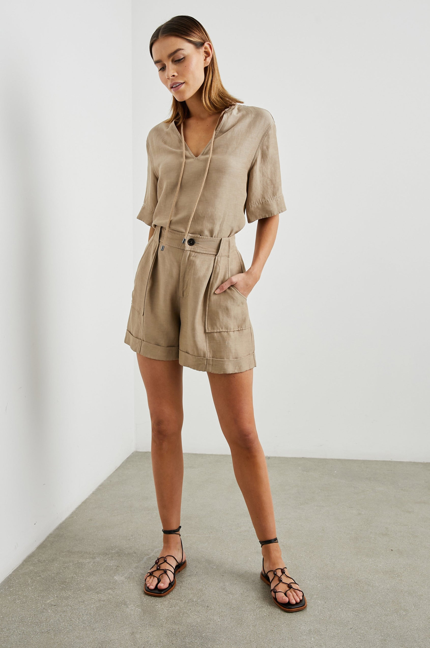 Maryam shorts with Cuffed Hems, Two Large Front Pockets, Two Back Patch Pockets, and Belt Loops in Safari Colorway - Front Full Body View Featured on Model