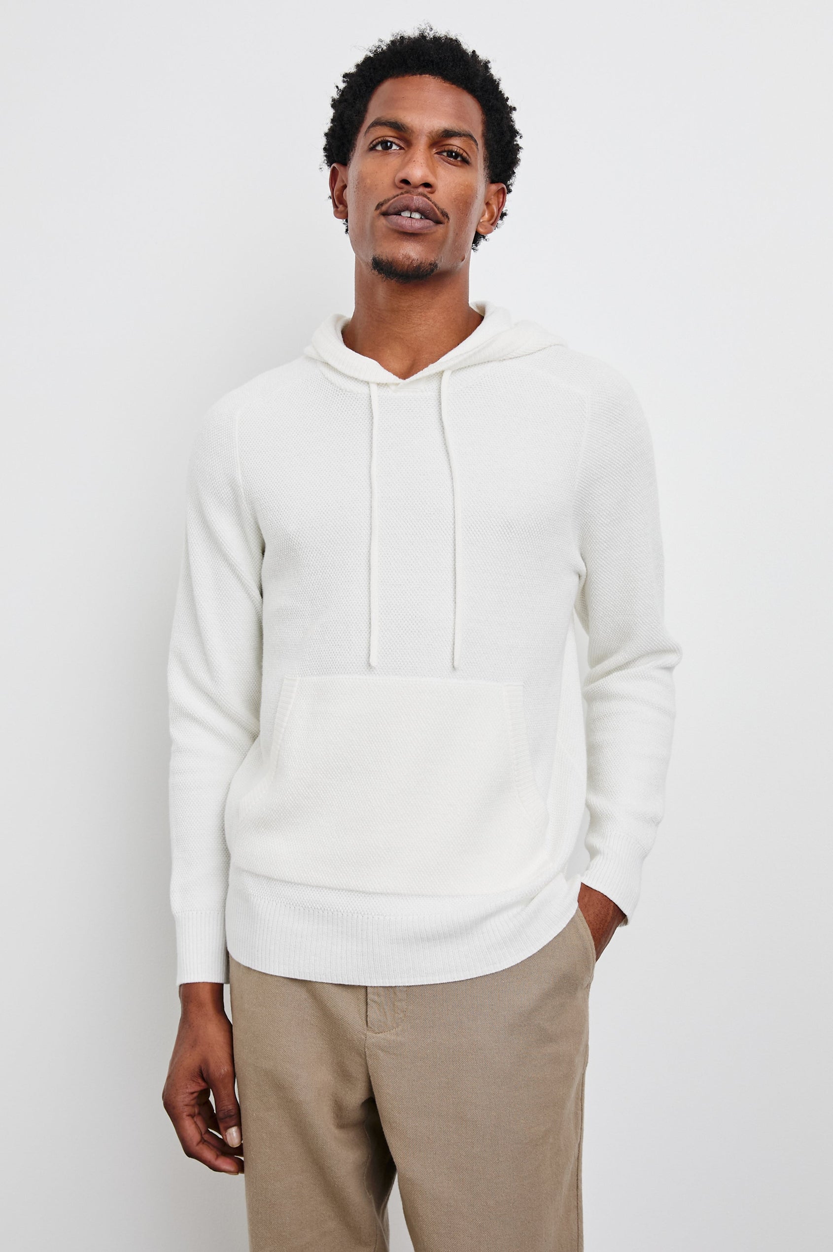 Matador Hoodie with Drawstring ties and a Kangaroo Pocket in White Colorway - Front View Featured on Model