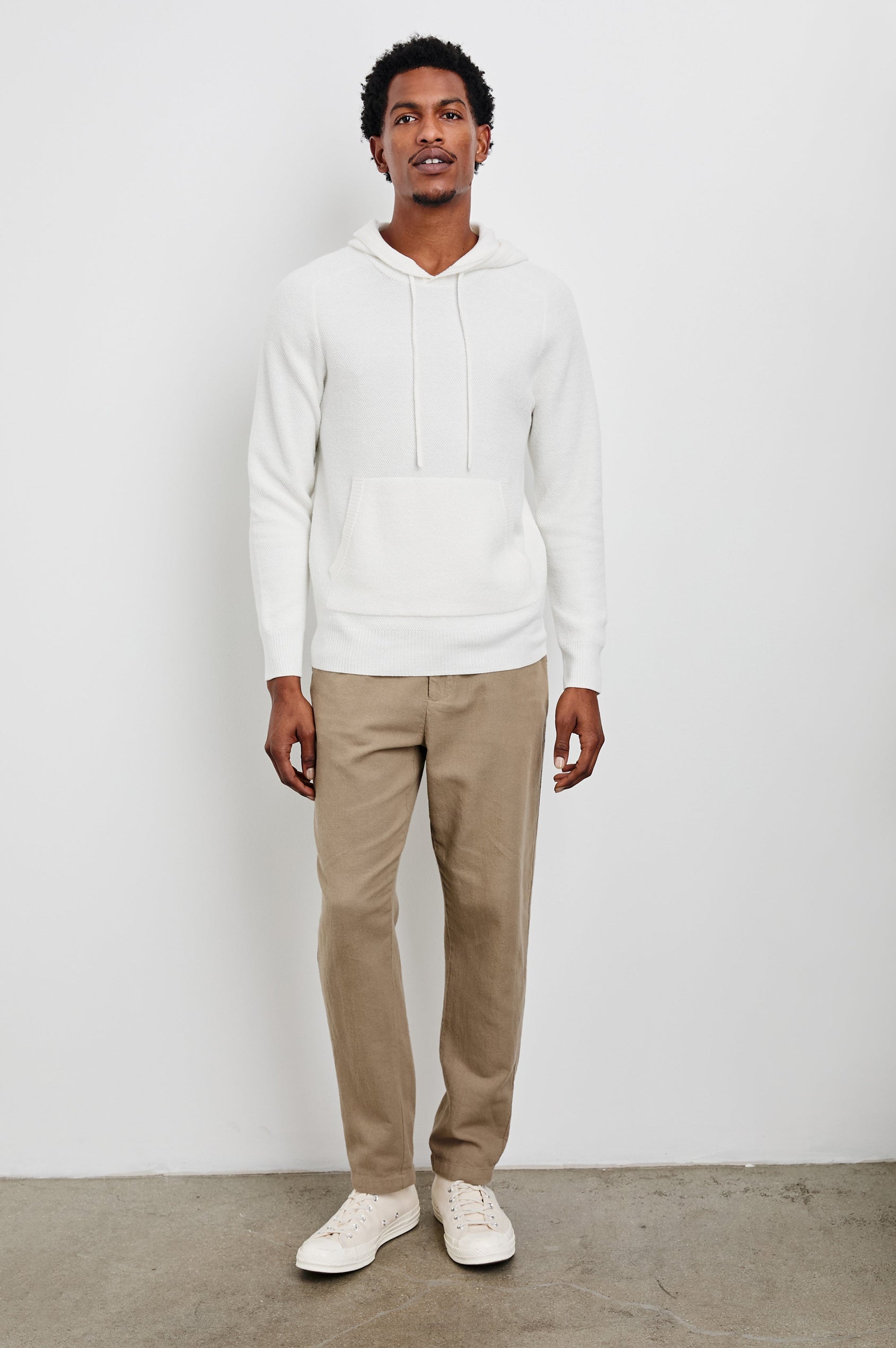 Matador Hoodie with Drawstring ties and a Kangaroo Pocket in White Colorway - Front Full Body View Featured on Model