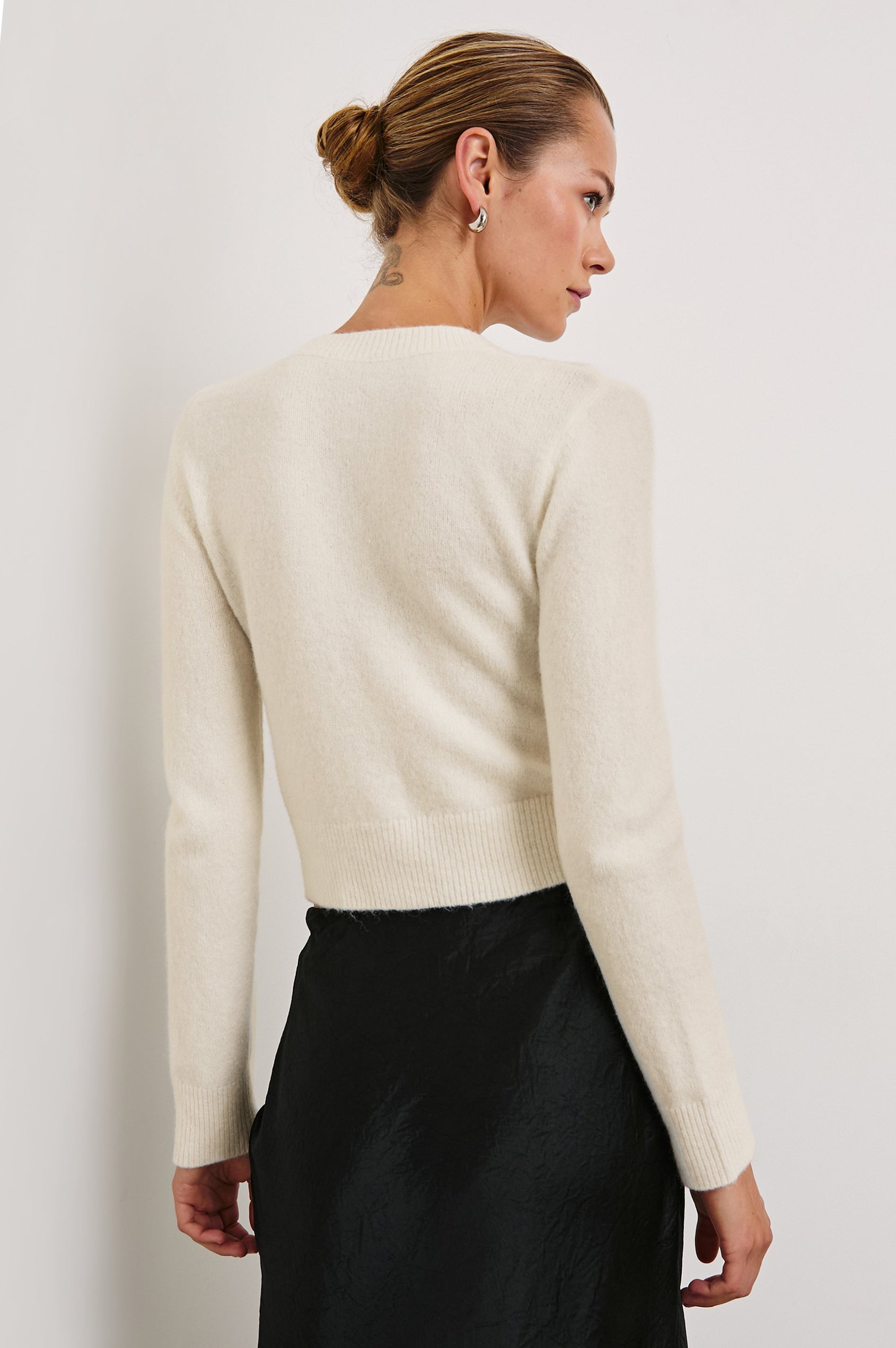 Matilda Cropped Long-Sleeve Sweater with Button Closure, Crew Neck and Ribbed Trim in Ivory Colorway - Back View Featured on Model